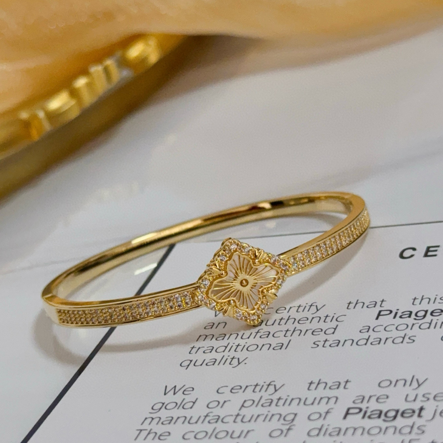 Piaget Rose bracelet yellow gold with clear diamond accents and mother-of-pearl flower detail 17cm inner circumference