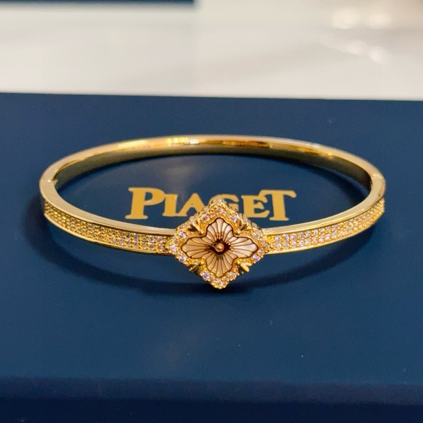 Piaget Rose bracelet yellow gold with clear diamond accents and mother-of-pearl flower detail 17cm inner circumference