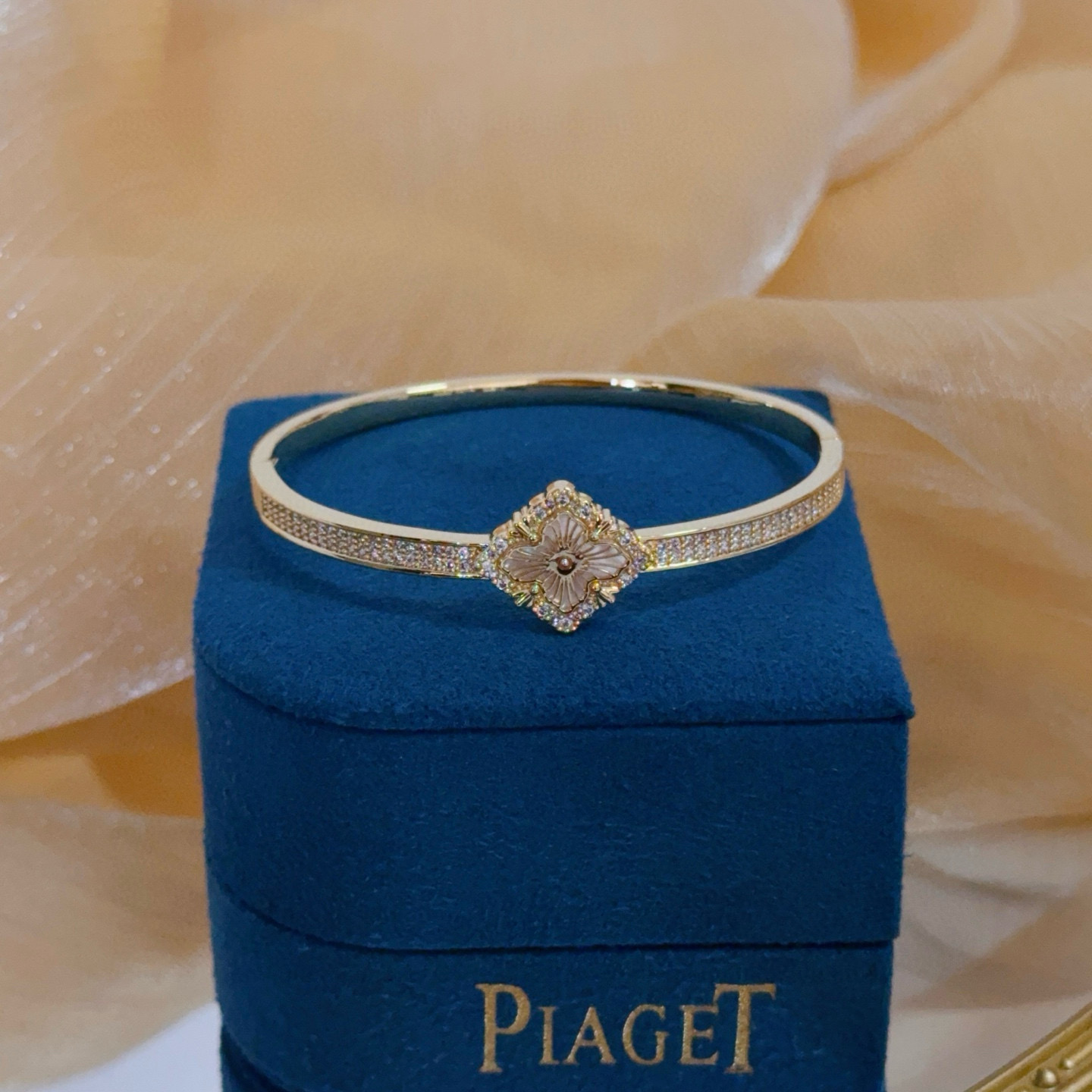 Piaget Rose bracelet yellow gold with clear diamond accents and mother-of-pearl flower detail 17cm inner circumference