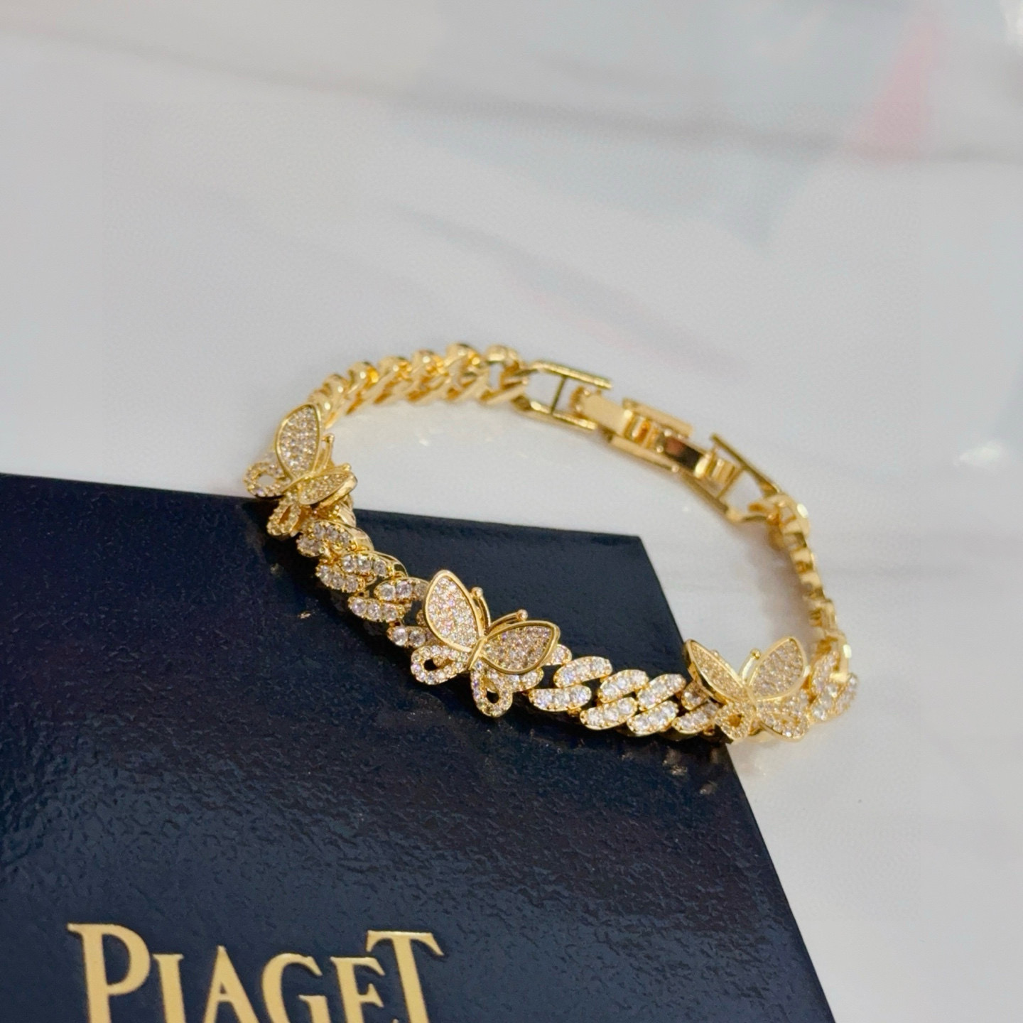 Piaget Butterfly Pave Cuban Link bracelet yellow gold with clear diamond-like pave stones 7 inches