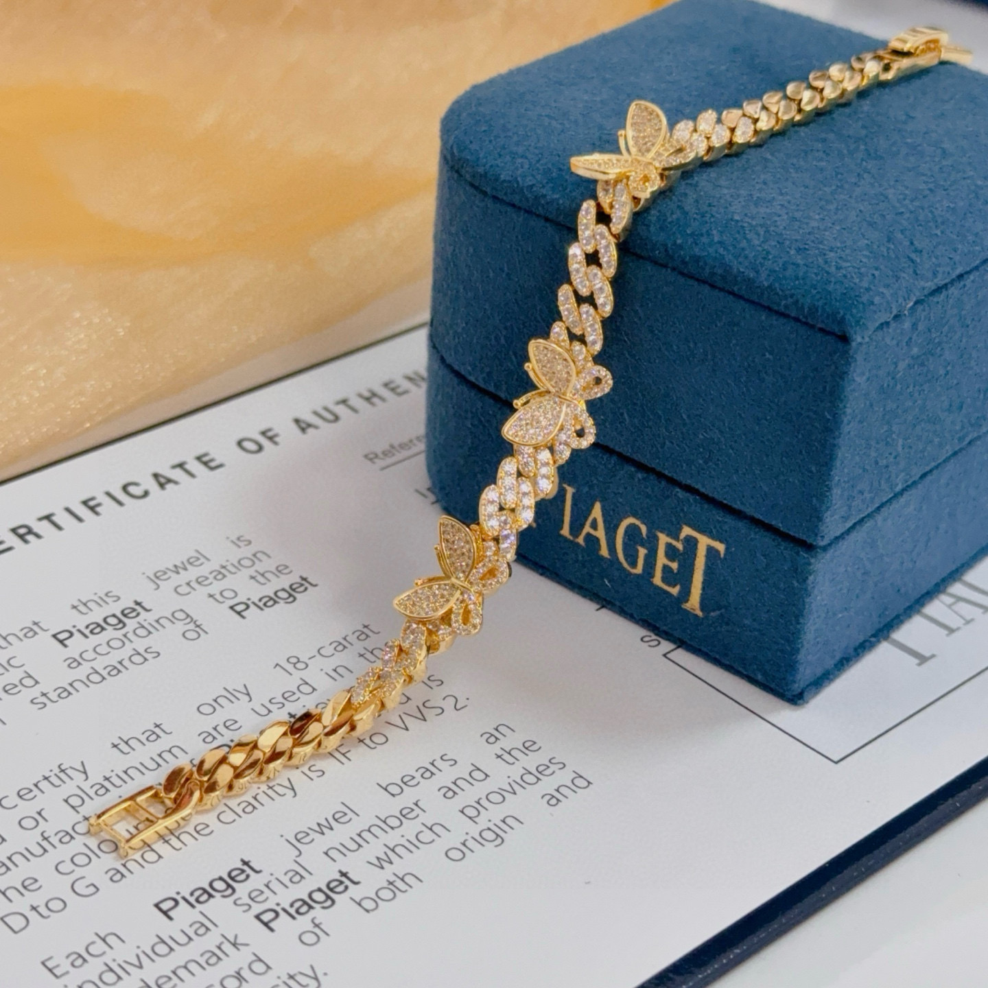 Piaget Butterfly Pave Cuban Link bracelet yellow gold with clear diamond-like pave stones 7 inches