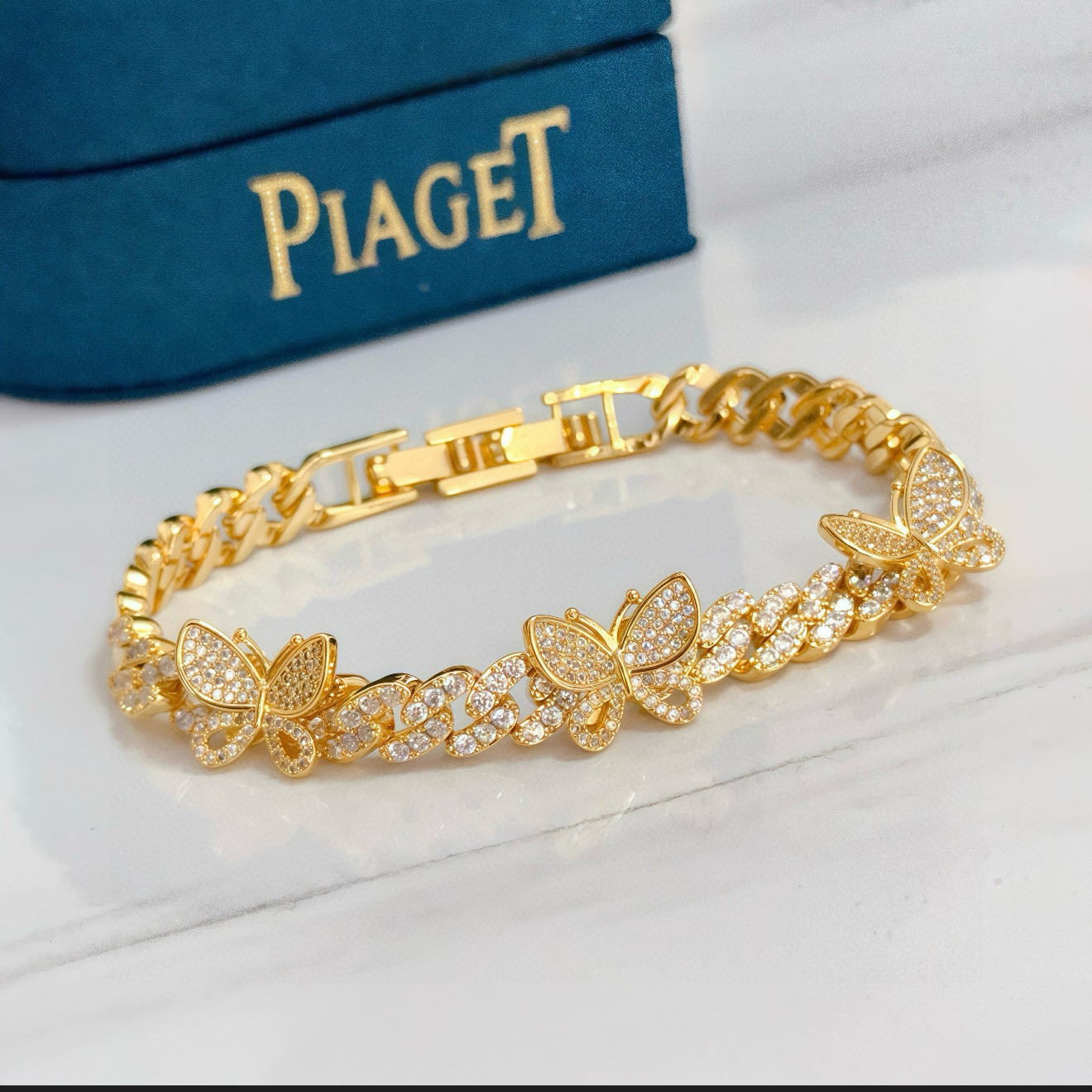 Piaget Butterfly Pave Cuban Link bracelet yellow gold with clear diamond-like pave stones 7 inches