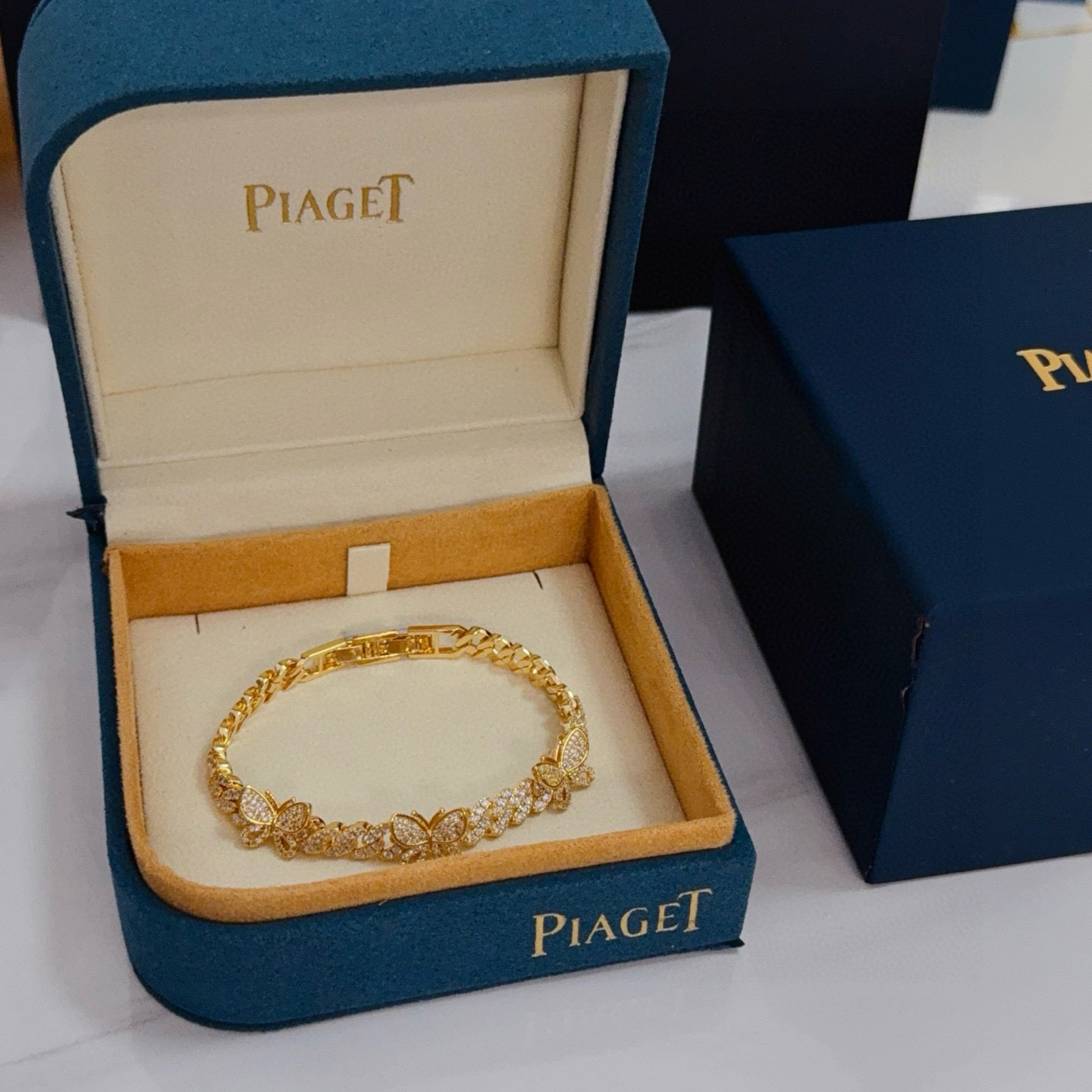 Piaget Butterfly Pave Cuban Link bracelet yellow gold with clear diamond-like pave stones 7 inches