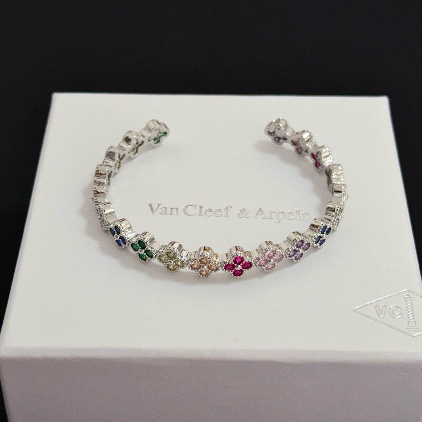 Van Cleef Arpels Alhambra bracelet Silver-toned metal with multicolor gemstones ruby red emerald green sapphire blue pink purple champagne 17cm