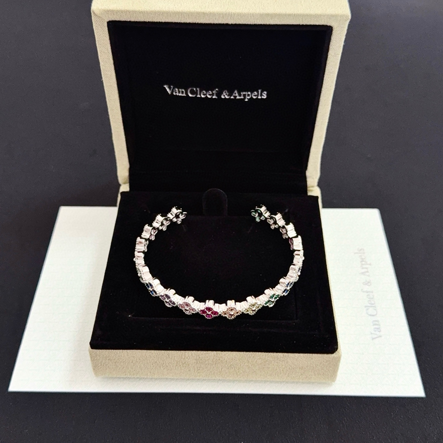 Van Cleef Arpels Alhambra bracelet Silver-toned metal with multicolor gemstones ruby red emerald green sapphire blue pink purple champagne 17cm