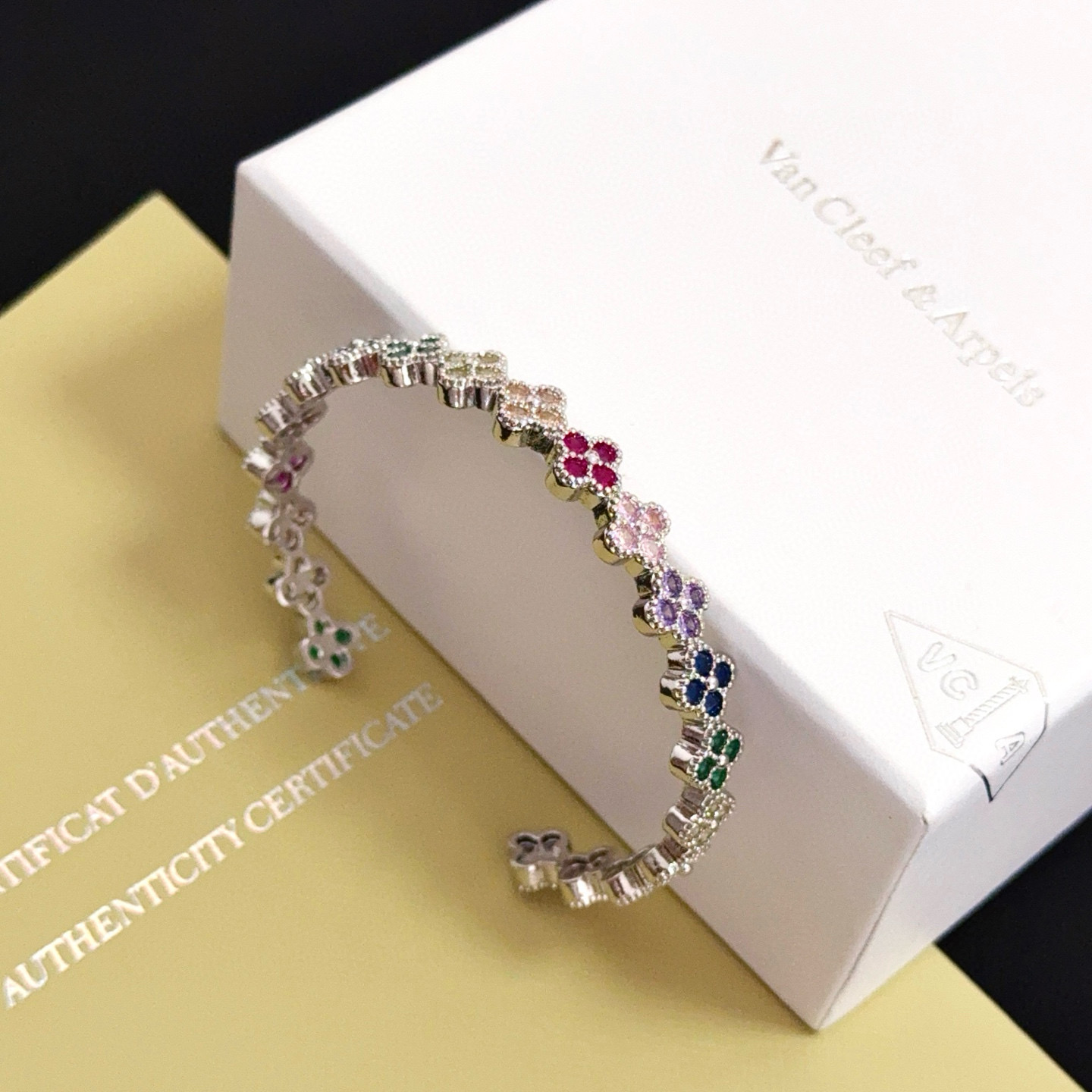 Van Cleef Arpels Alhambra bracelet Silver-toned metal with multicolor gemstones ruby red emerald green sapphire blue pink purple champagne 17cm
