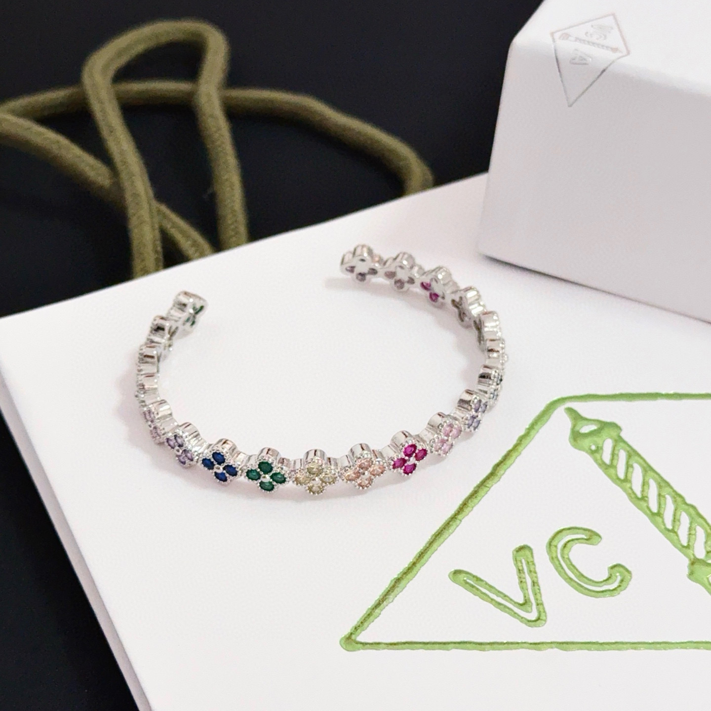 Van Cleef Arpels Alhambra bracelet Silver-toned metal with multicolor gemstones ruby red emerald green sapphire blue pink purple champagne 17cm