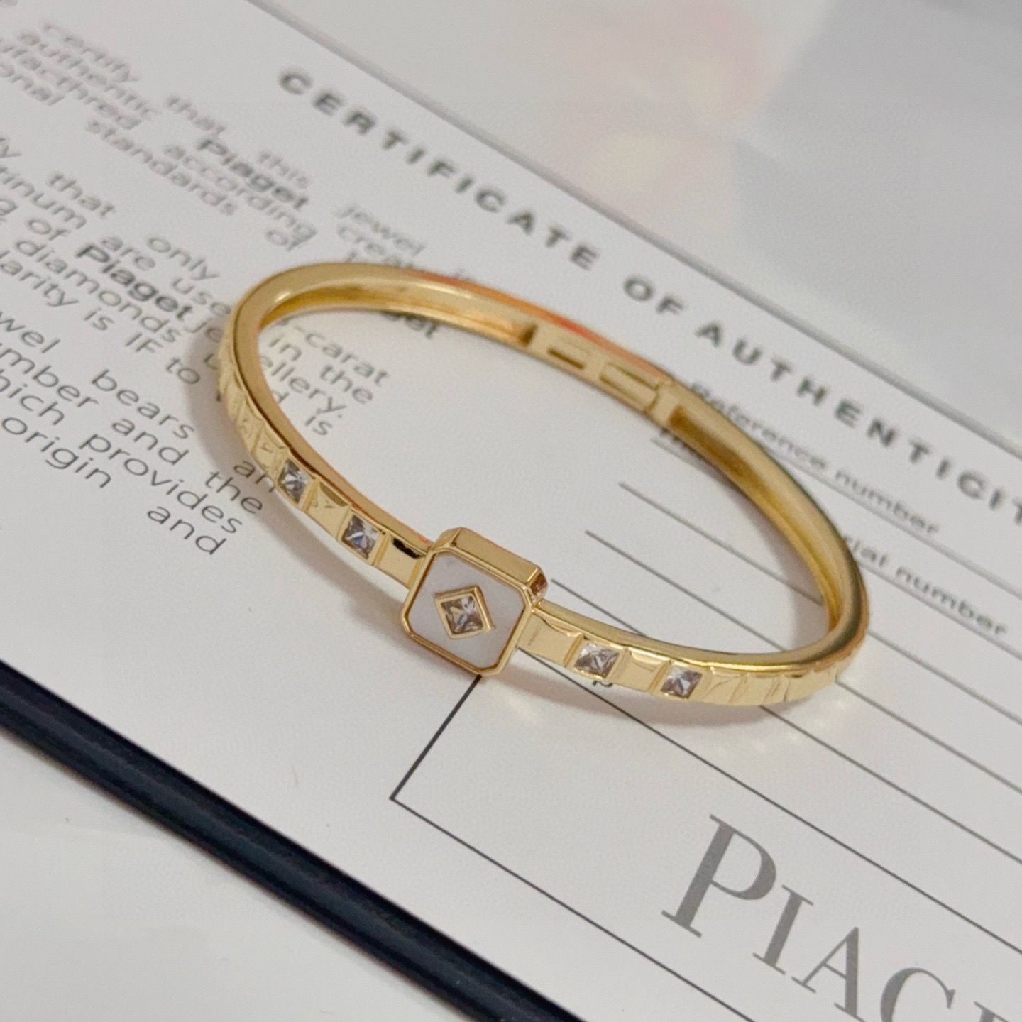 Piaget Possession bracelet yellow gold metal white mother-of-pearl inlay clear diamond accents 17cm inner circumference