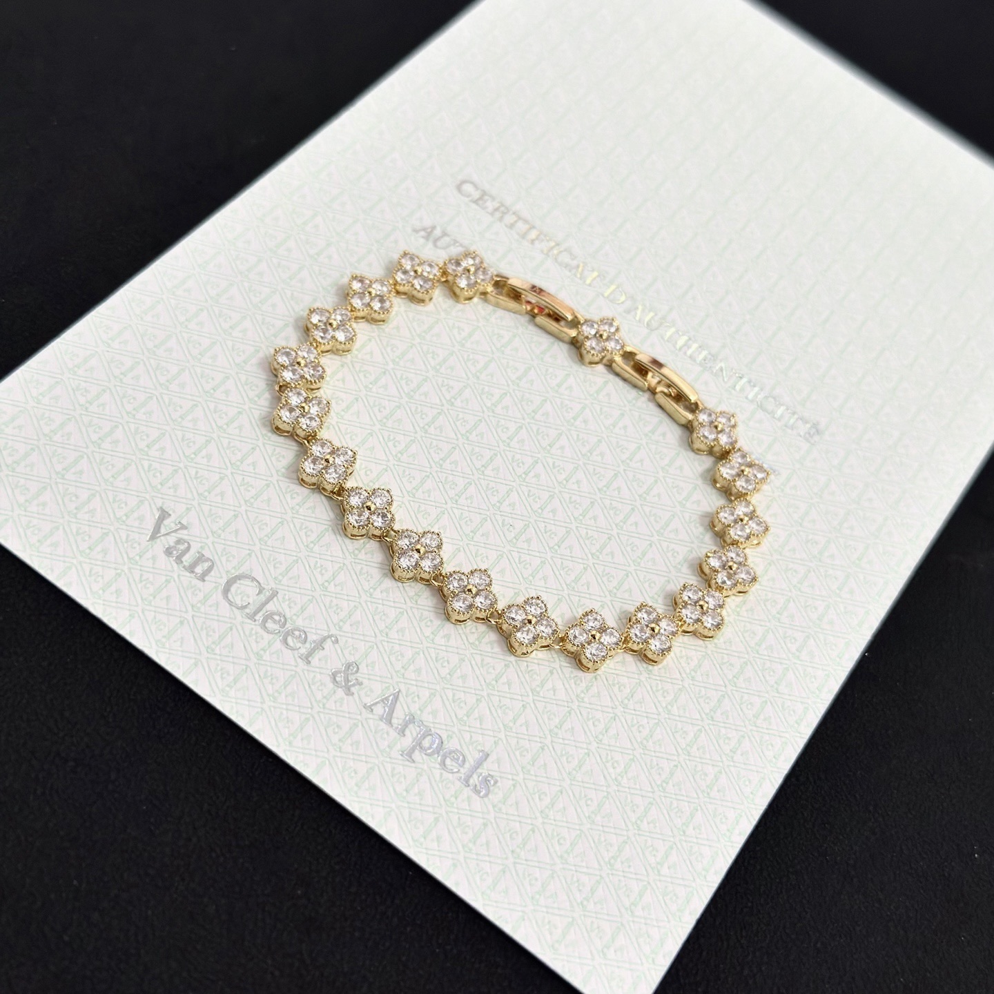 Van Cleef Arpels Alhambra bracelet yellow gold with clear faceted gemstones 18cm