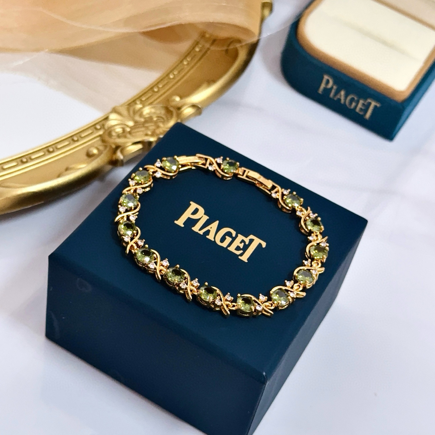 Piaget Rose Vine Gemstone Line Bracelet bracelet Yellow gold metal with peridot green gemstones and clear diamond accent stones 18cm