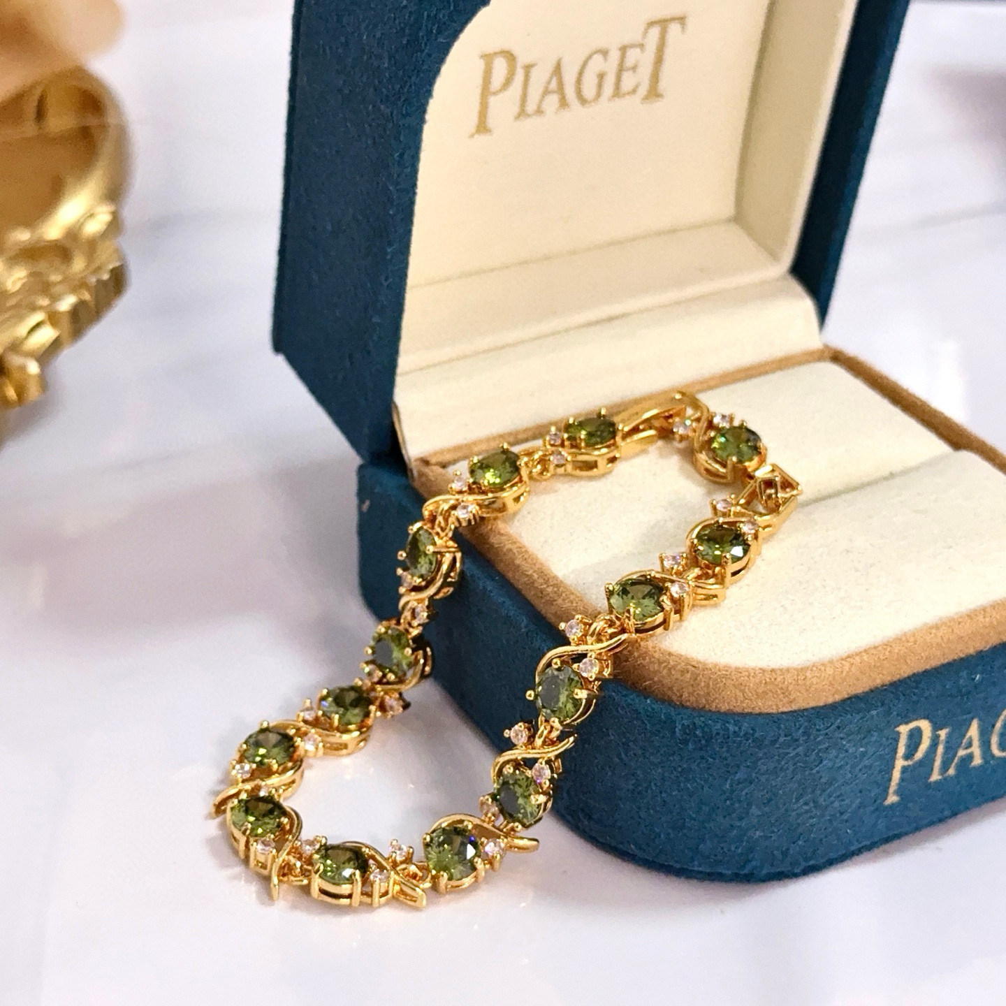 Piaget Rose Vine Gemstone Line Bracelet bracelet Yellow gold metal with peridot green gemstones and clear diamond accent stones 18cm