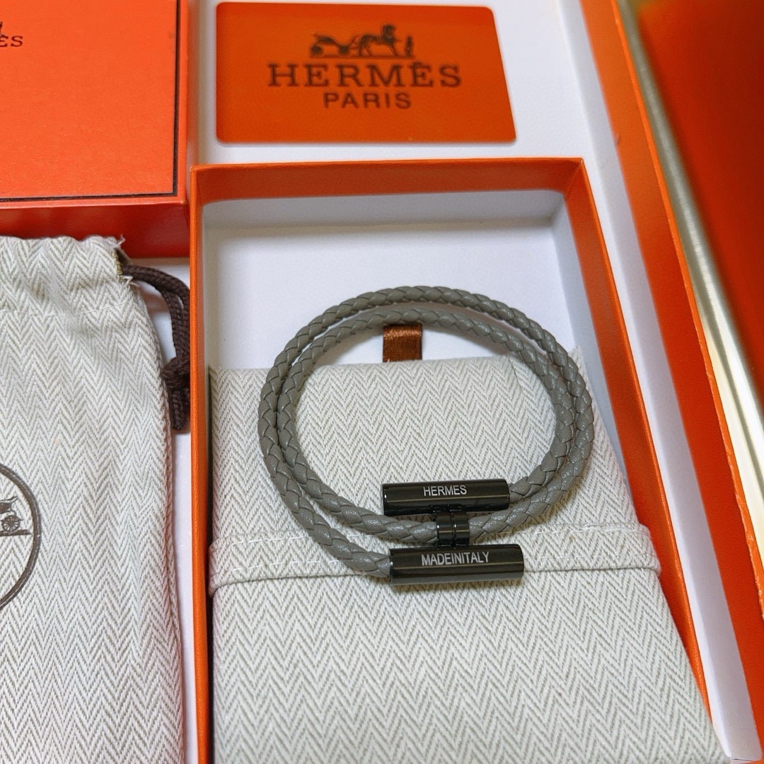 Bracciale Hermes Tournis Tresse in pelle intrecciata grigia hardware nero canna di fucile 19 cm