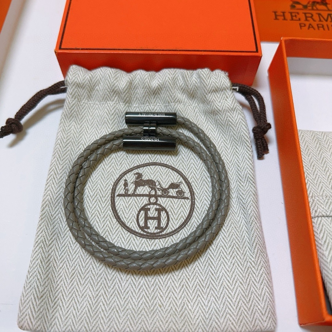 Bracciale Hermes Tournis Tresse in pelle intrecciata grigia hardware nero canna di fucile 19 cm