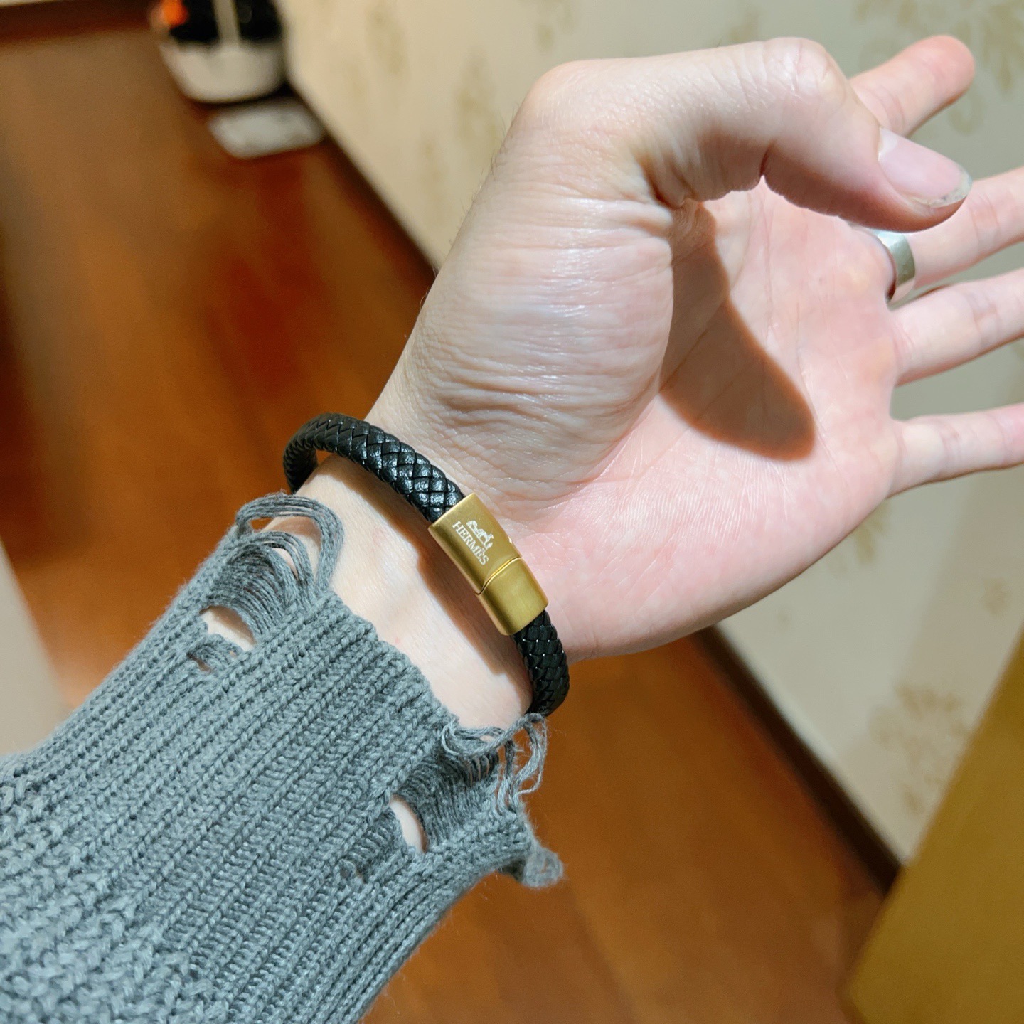 Bracciale Hermes Jet Braided Leather Bracciale Pelle intrecciata nera con hardware in metallo color oro 19 cm