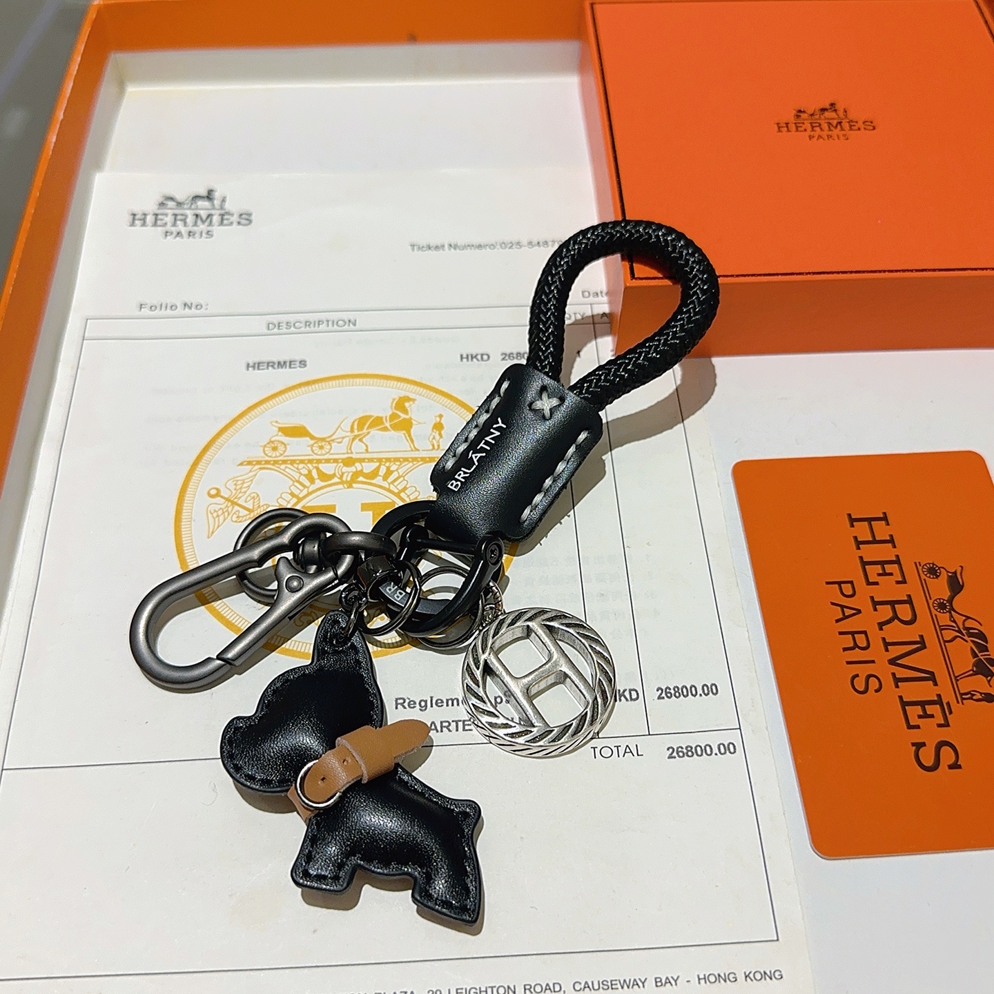 Hermes H Logo Bulldog Charm Portachiavi pendente canna di fucile metallo argento cordone intrecciato nero pelle nera accento in pelle marrone chiaro lunghezza totale 10 cm