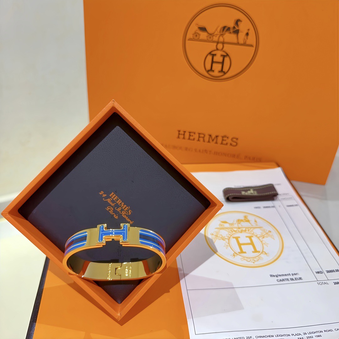 Bracciale Hermes Clic H in metallo placcato oro con smalto blu navy e giallo PM