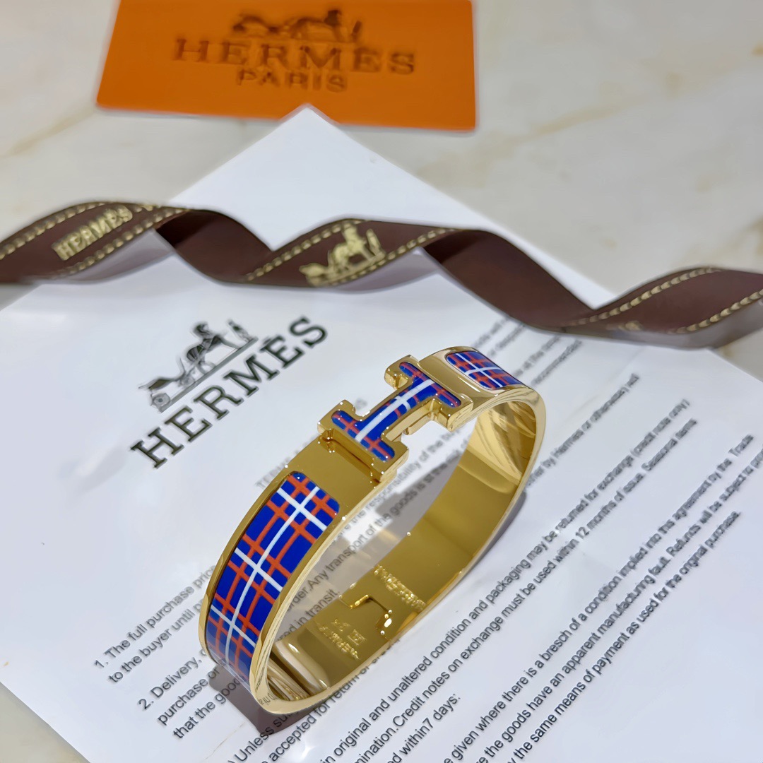 Bracciale Hermes Clic H in metallo placcato oro con smalto tartan blu rosso bianco PM