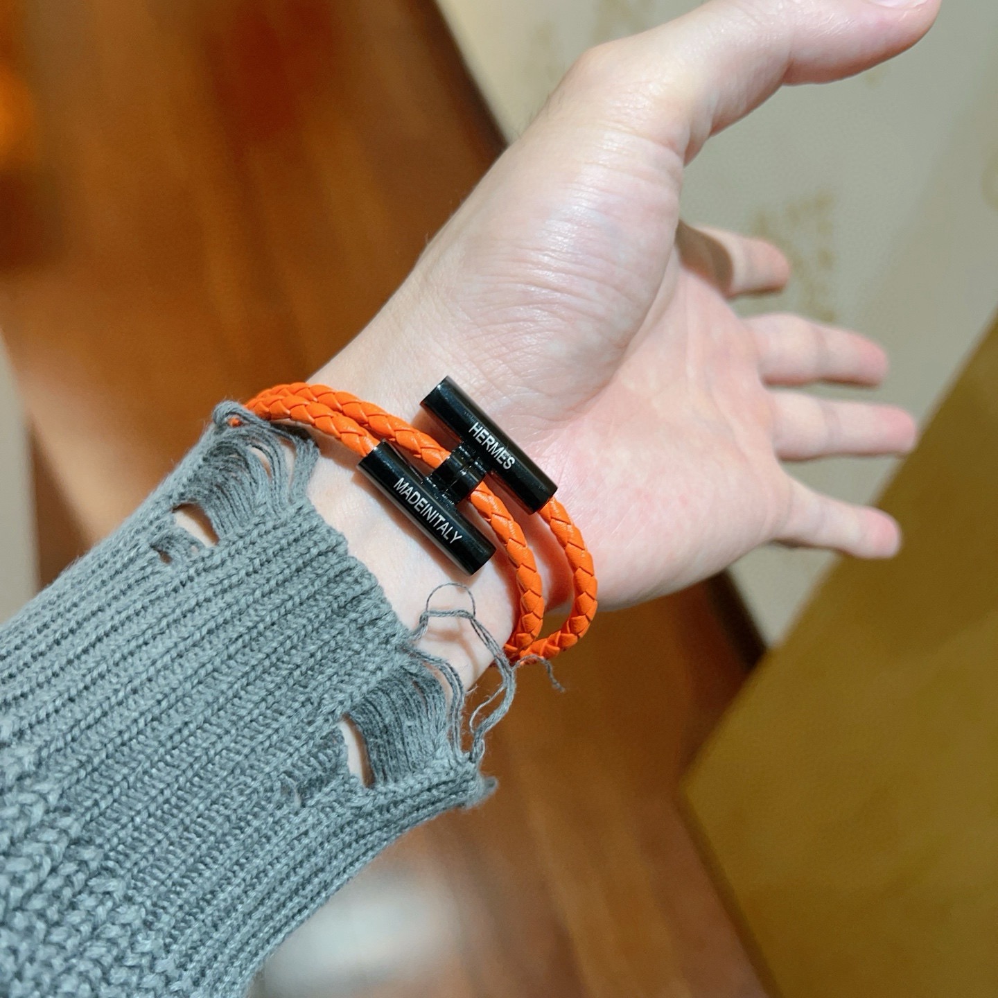 Bracciale Hermes Tournis Tresse Pelle intrecciata arancione con hardware in metallo nero 19 cm
