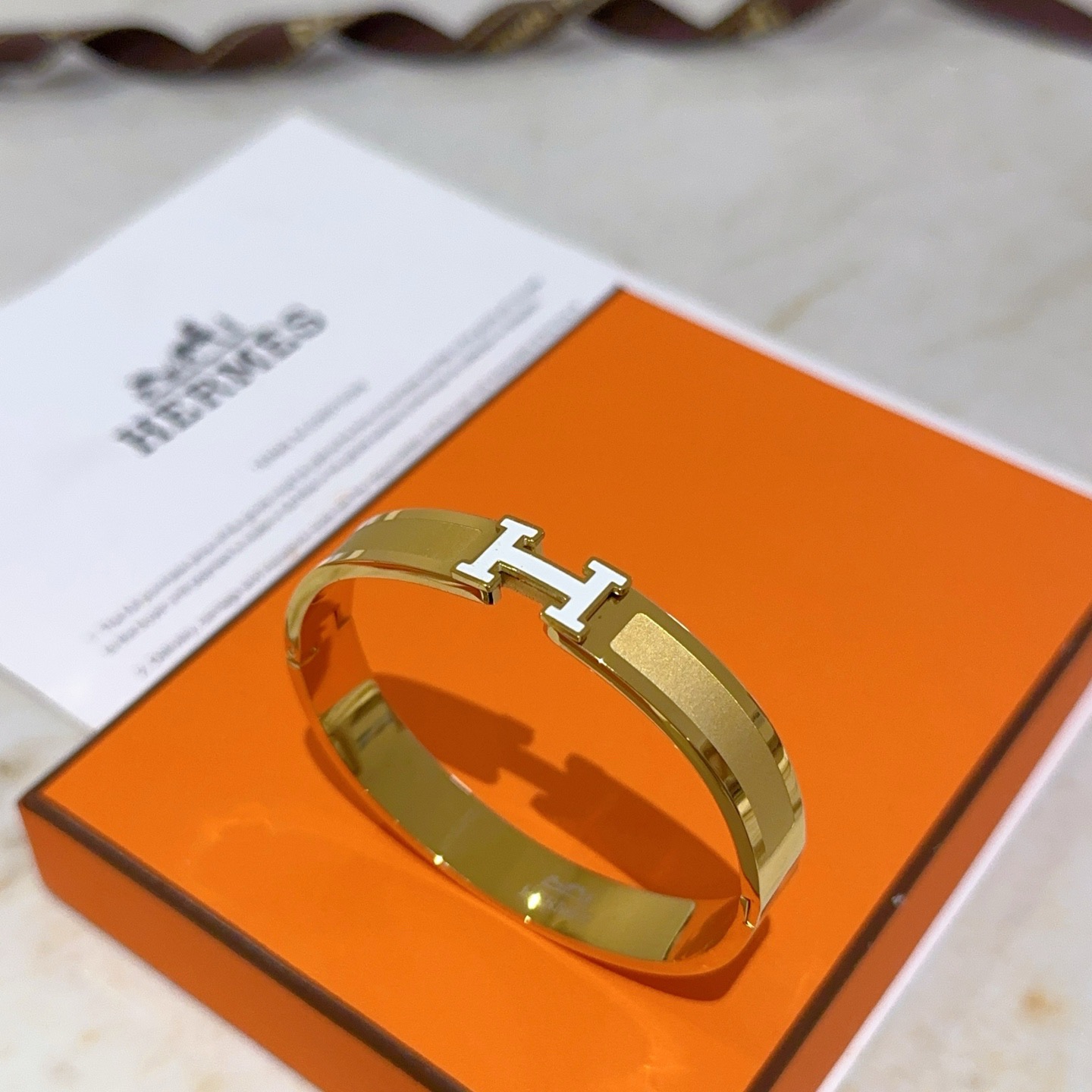 Hermes Clic H bracelet gold plated metal with white enamel PM