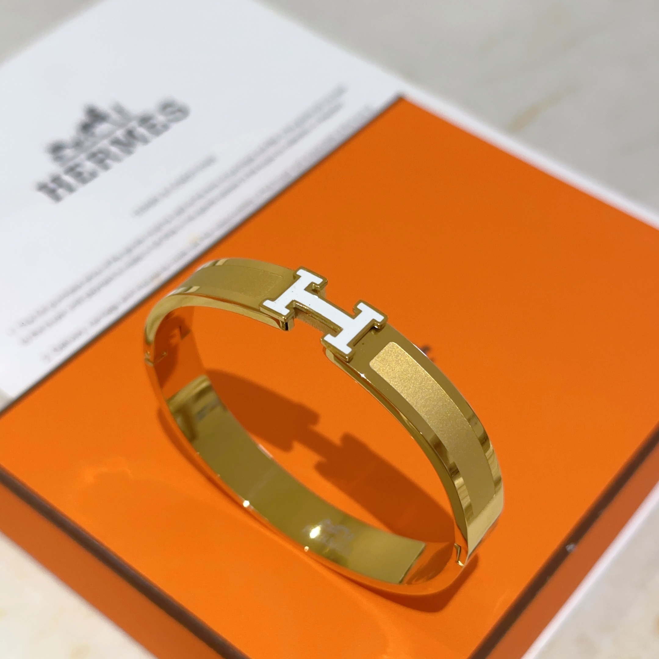 Hermes Clic H bracelet gold plated metal with white enamel PM