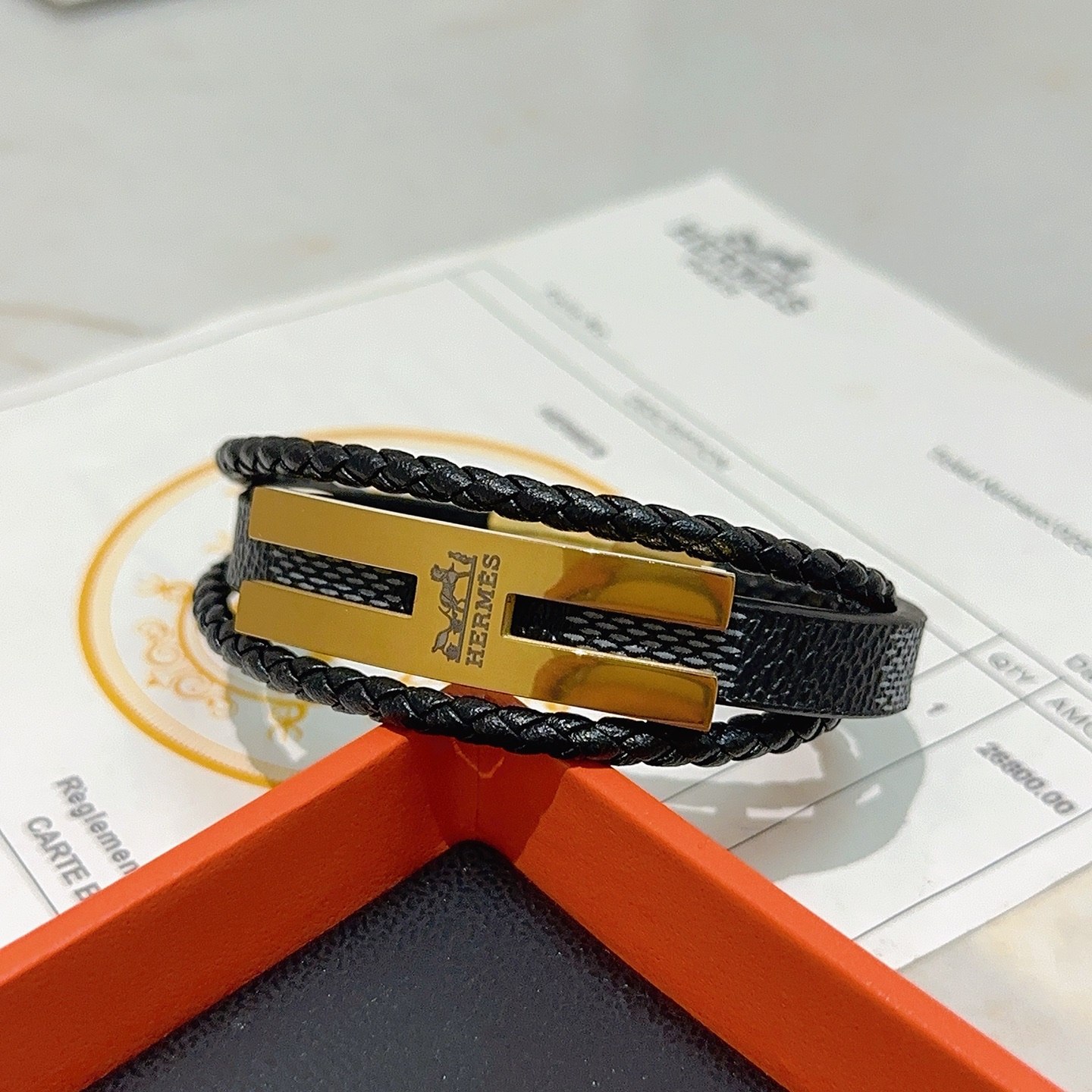 Bracciale Hermes Anger Forest in metallo color oro, pelle intrecciata nera, pelle martellata nera 20 cm