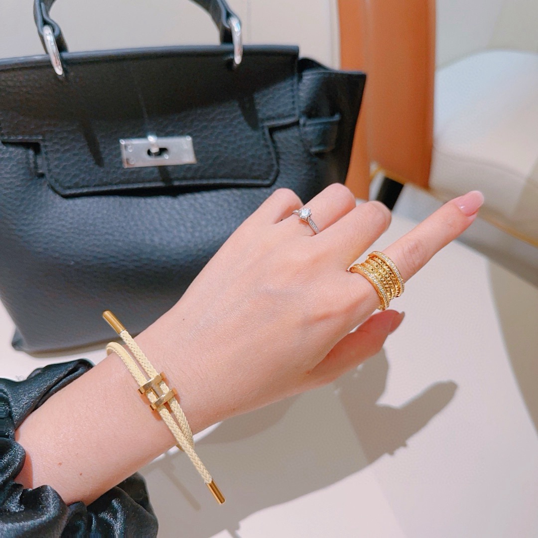 Bracciale Hermes Tournis Tresse H cordone intrecciato giallo crema hardware in metallo placcato oro cordino scorrevole regolabile adatto per polso da 15-19 cm