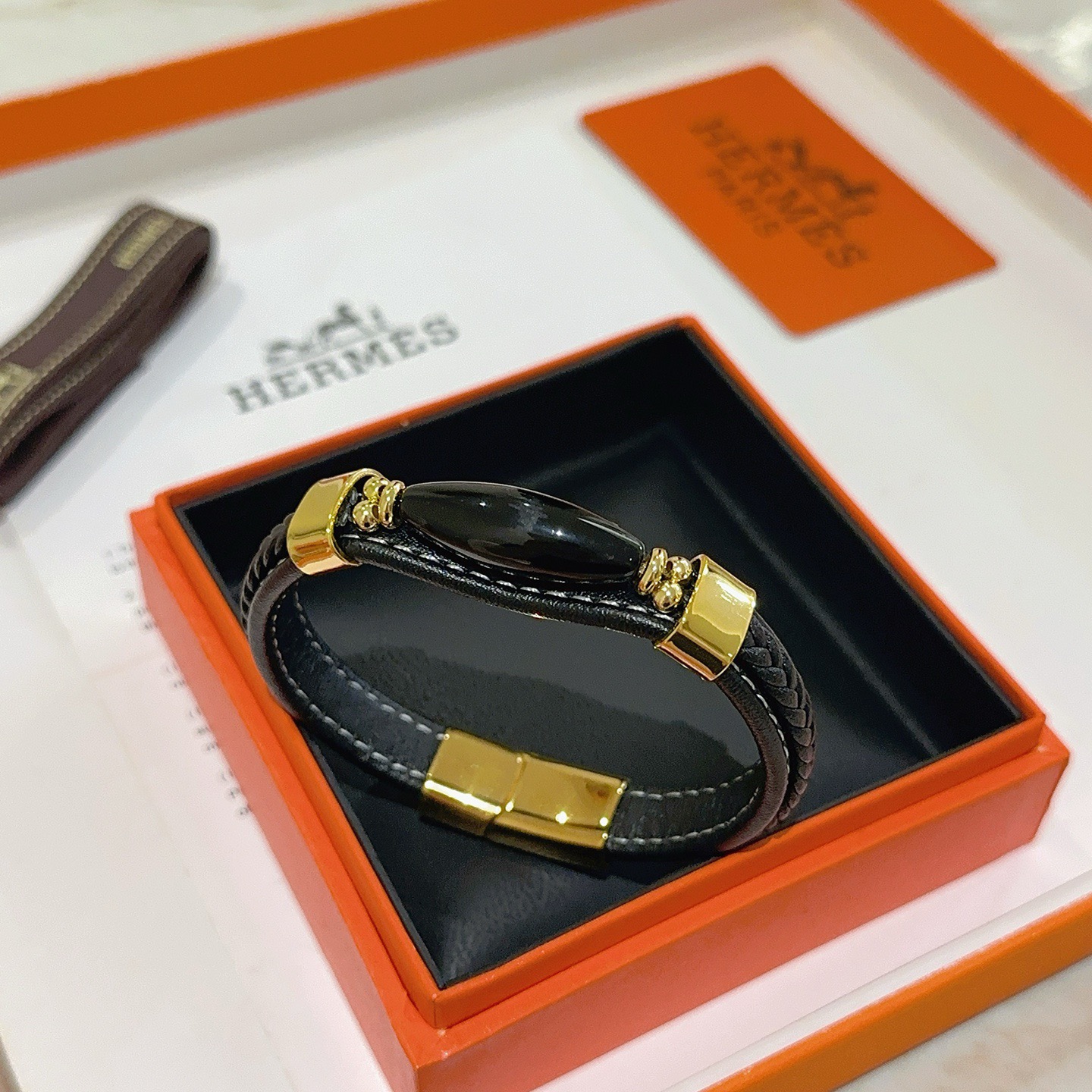 Bracciale Hermes Anger Forest Pelle intrecciata nera con hardware in metallo color oro e accento in onice nero 18 cm