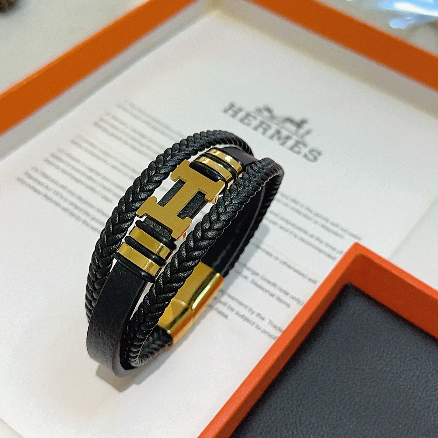 Bracciale Hermes New Anger Forest H Logo in pelle intrecciata nera hardware in metallo color oro 19 cm