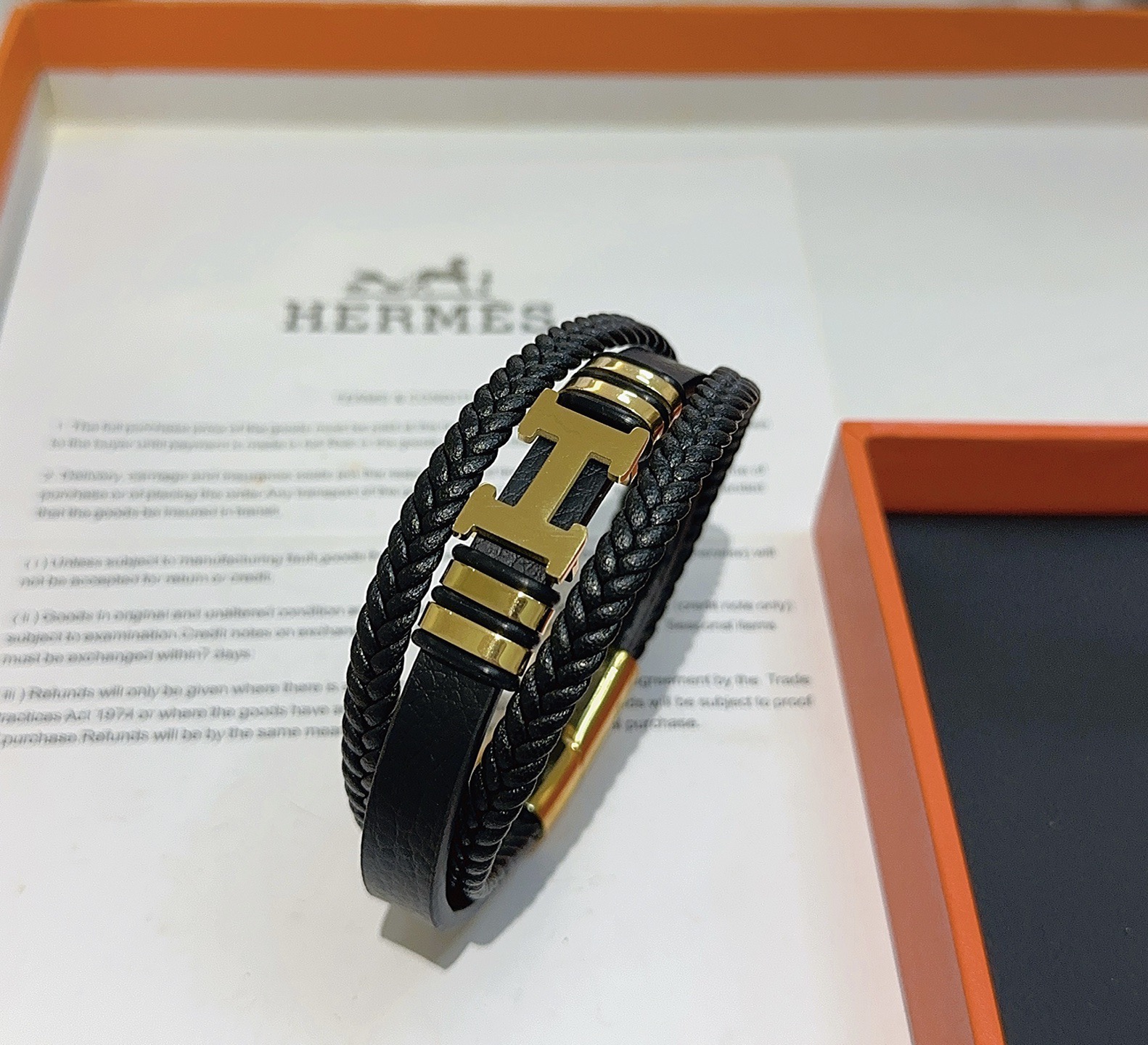 Bracciale Hermes New Anger Forest H Logo in pelle intrecciata nera hardware in metallo color oro 19 cm