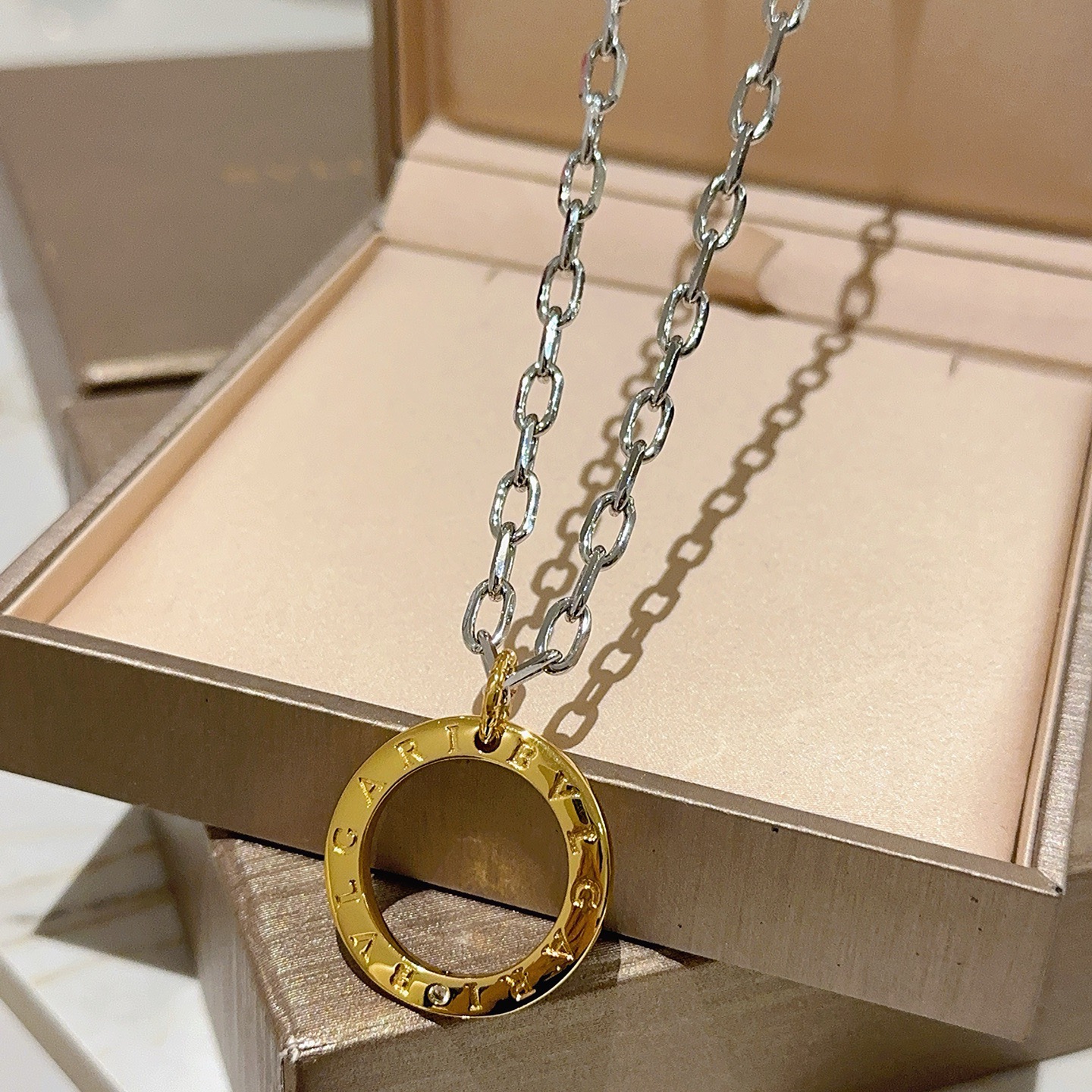 Bvlgari Bvlgari Bvlgari necklace Silver-toned chain gold-toned circular pendant no gemstones 60cm