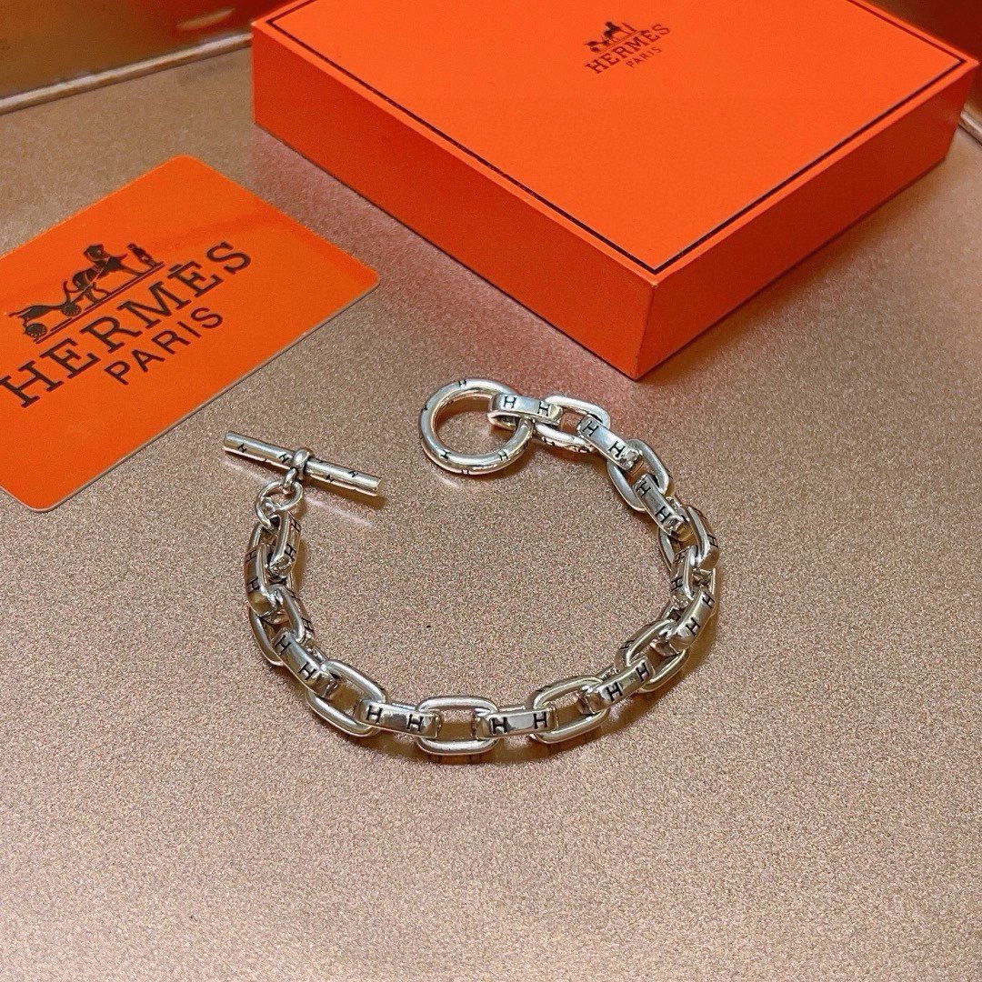 Bracelet Hermes H d Ancre métal argenté détails H gravés noirs 19cm