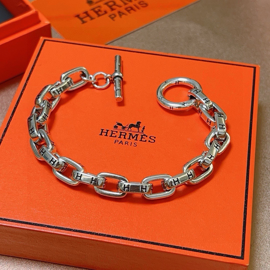 Bracelet Hermes H d Ancre métal argenté détails H gravés noirs 19cm