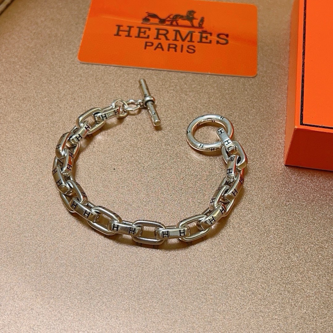 Bracelet Hermes H d Ancre métal argenté détails H gravés noirs 19cm