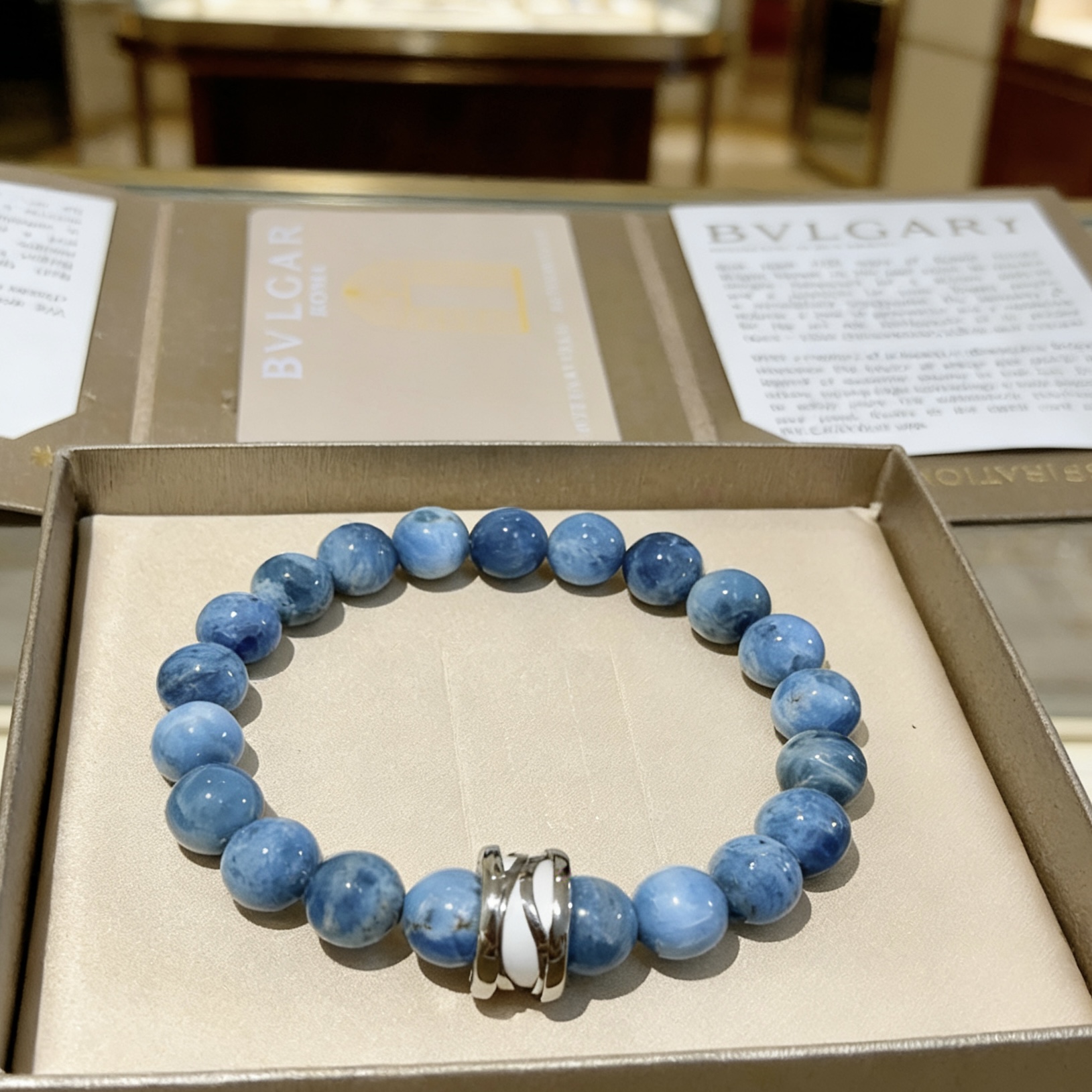 Bvlgari DIVAS DREAM bracelet Silver-toned metal with white enamel accent variegated blue stone beads 20