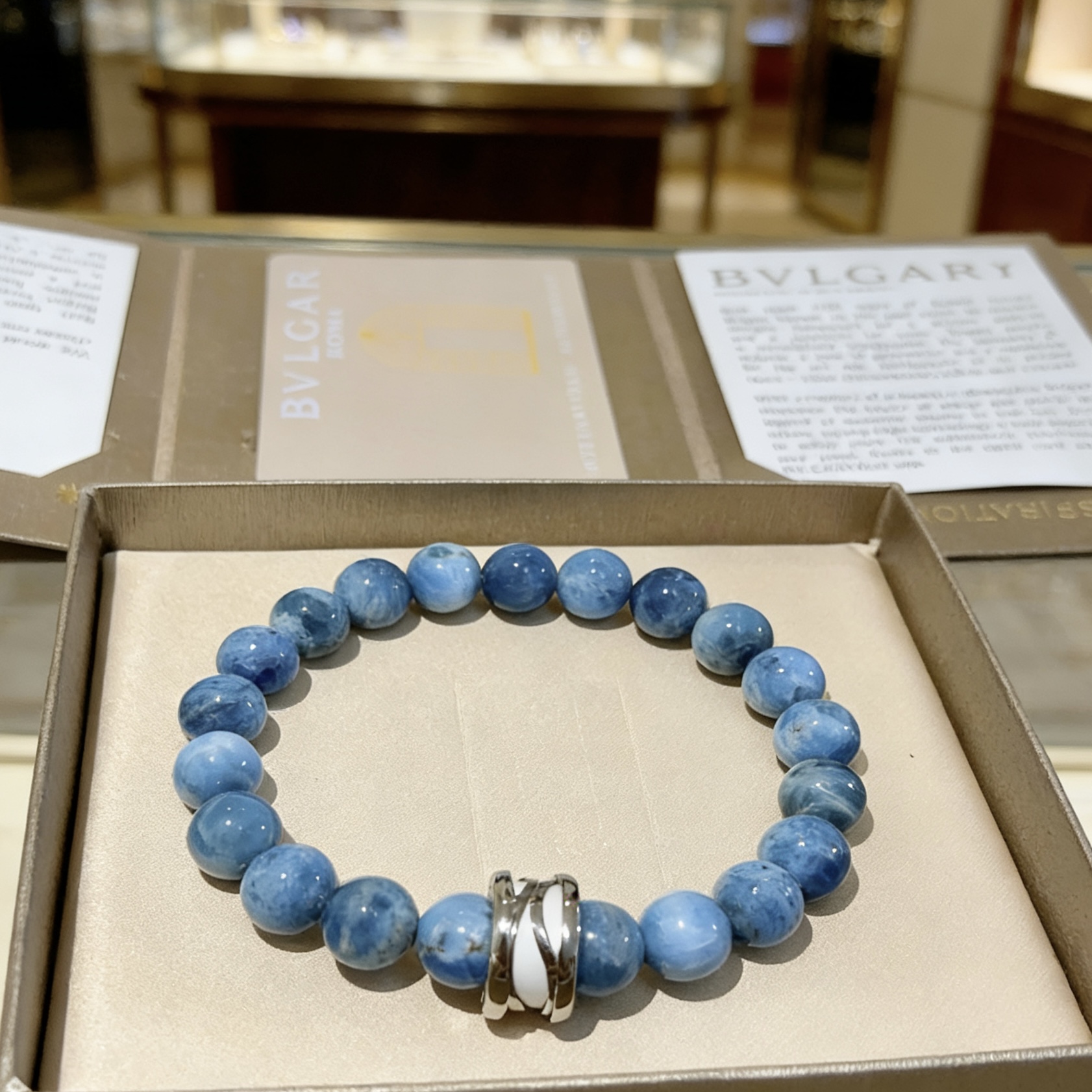 Bvlgari DIVAS DREAM bracelet Silver-toned metal with white enamel accent variegated blue stone beads 20