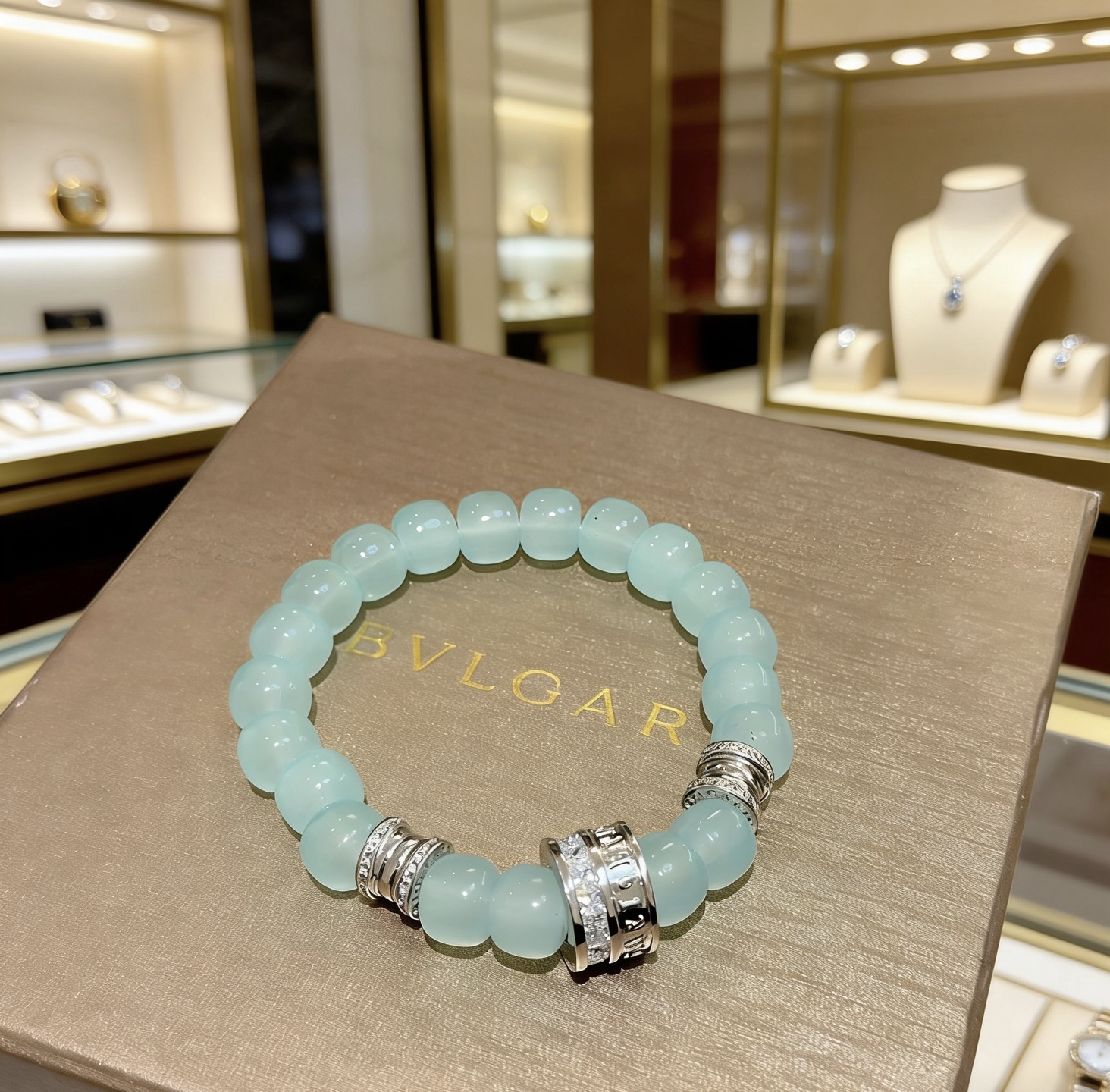 Bvlgari B zero1 bracelet Silver-toned metal with pale aqua blue beads and clear diamond accents 18cm