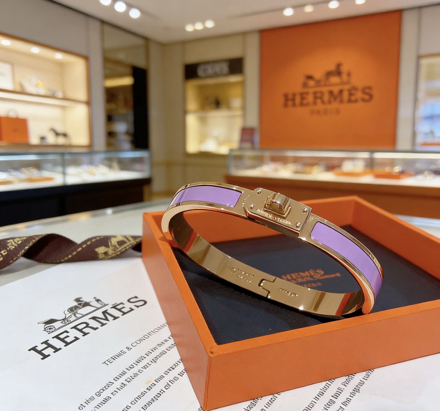 Bracciale Hermes Kelly in metallo oro rosa con smalto viola lavanda 17 cm