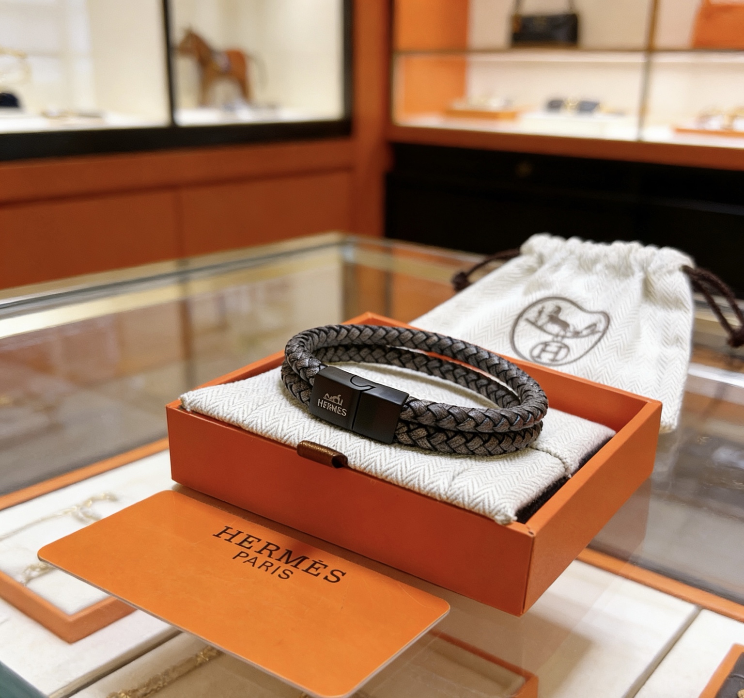 Bracciale Hermes Tournis Tresse chiusura in metallo nero opaco pelle intrecciata grigio scuro 19 cm