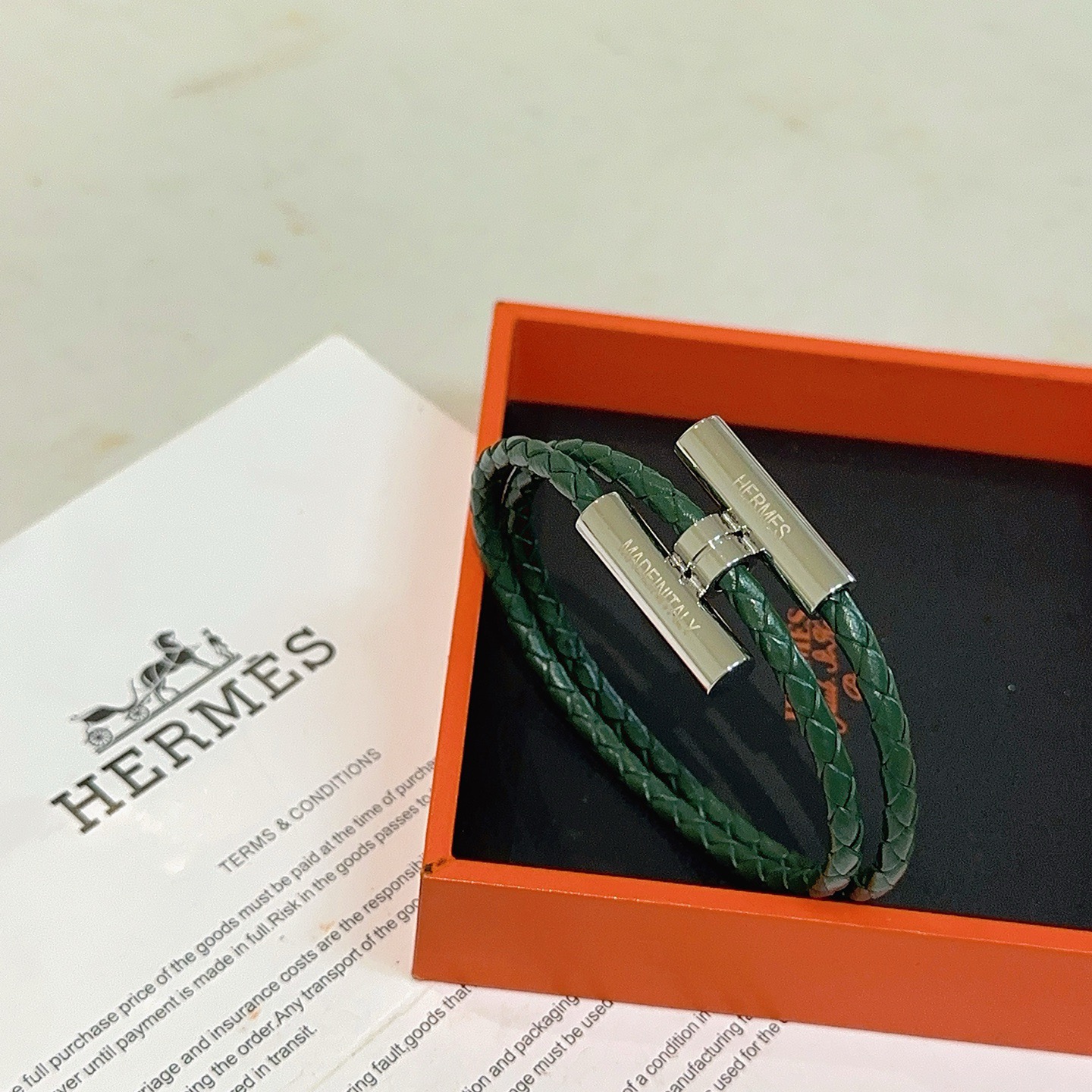 Pulsera Hermes Tournis Tresse de cuero trenzado verde oscuro con herrajes plateados paladiados de 19 cm