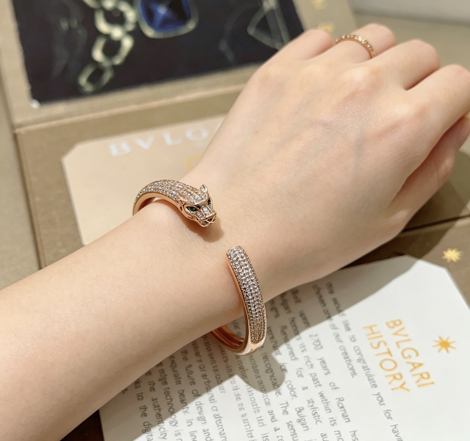 Cartier Panthere de Cartier bracelet 18K rose gold pave set white diamonds green tsavorite garnet eyes 17