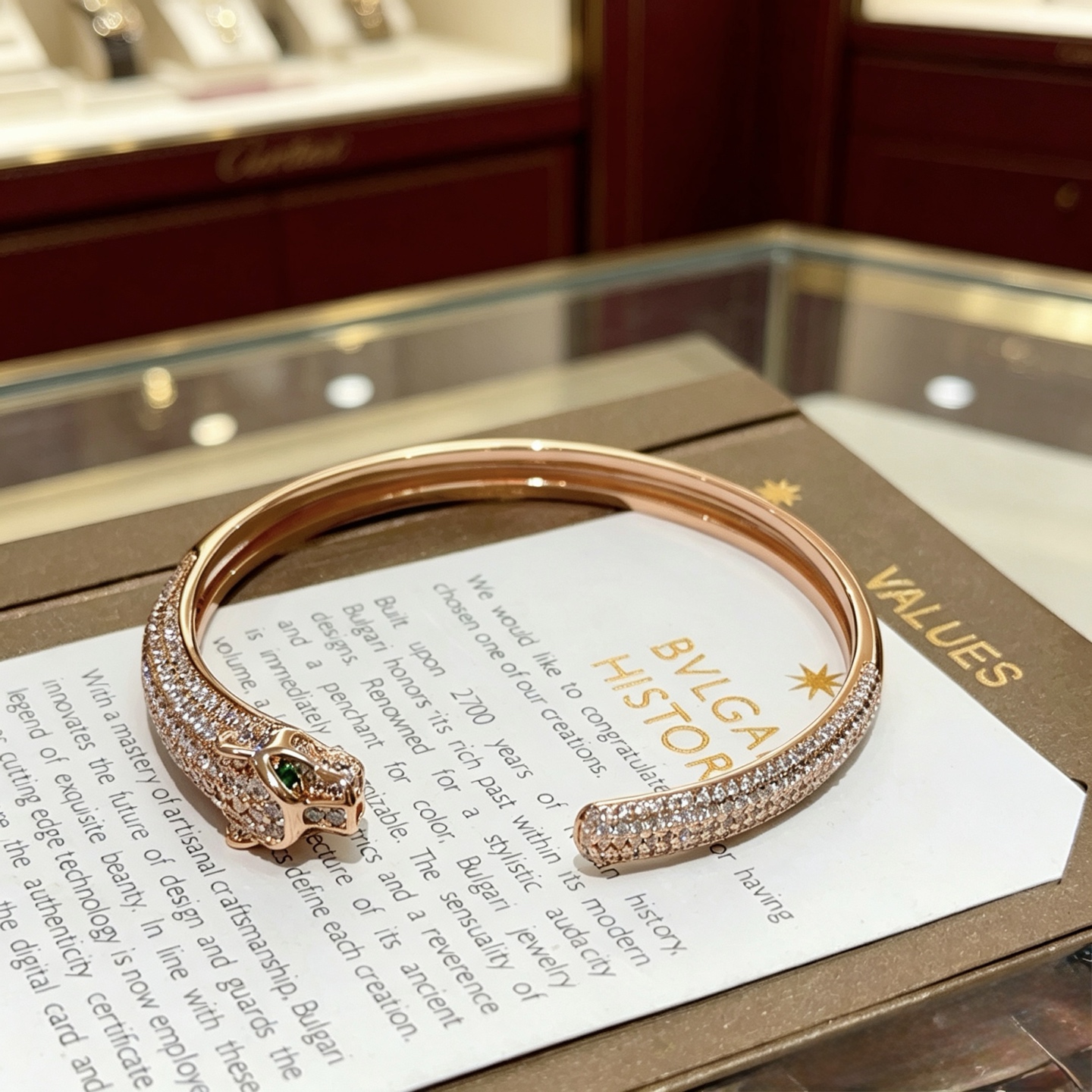 Cartier Panthere de Cartier bracelet 18K rose gold pave set white diamonds green tsavorite garnet eyes 17