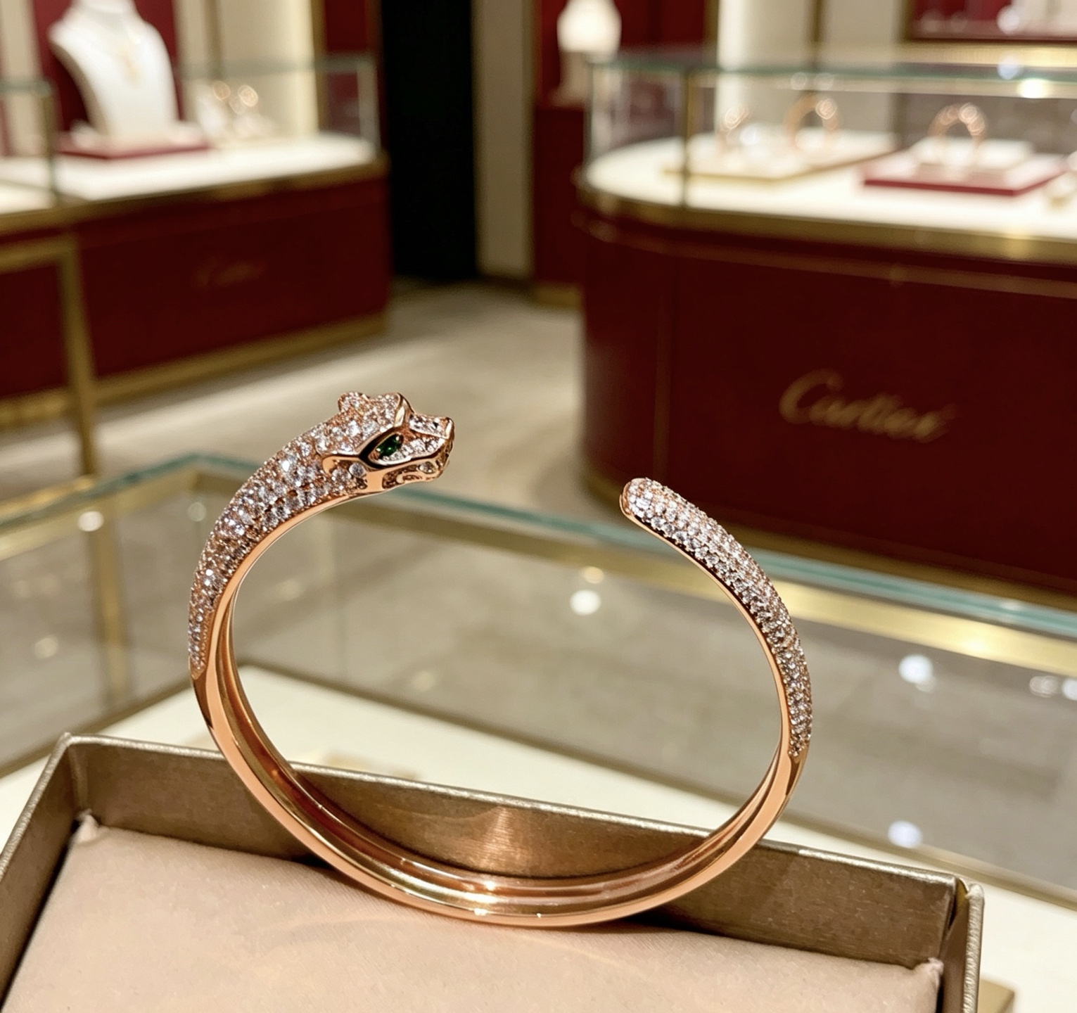Cartier Panthere de Cartier bracelet 18K rose gold pave set white diamonds green tsavorite garnet eyes 17