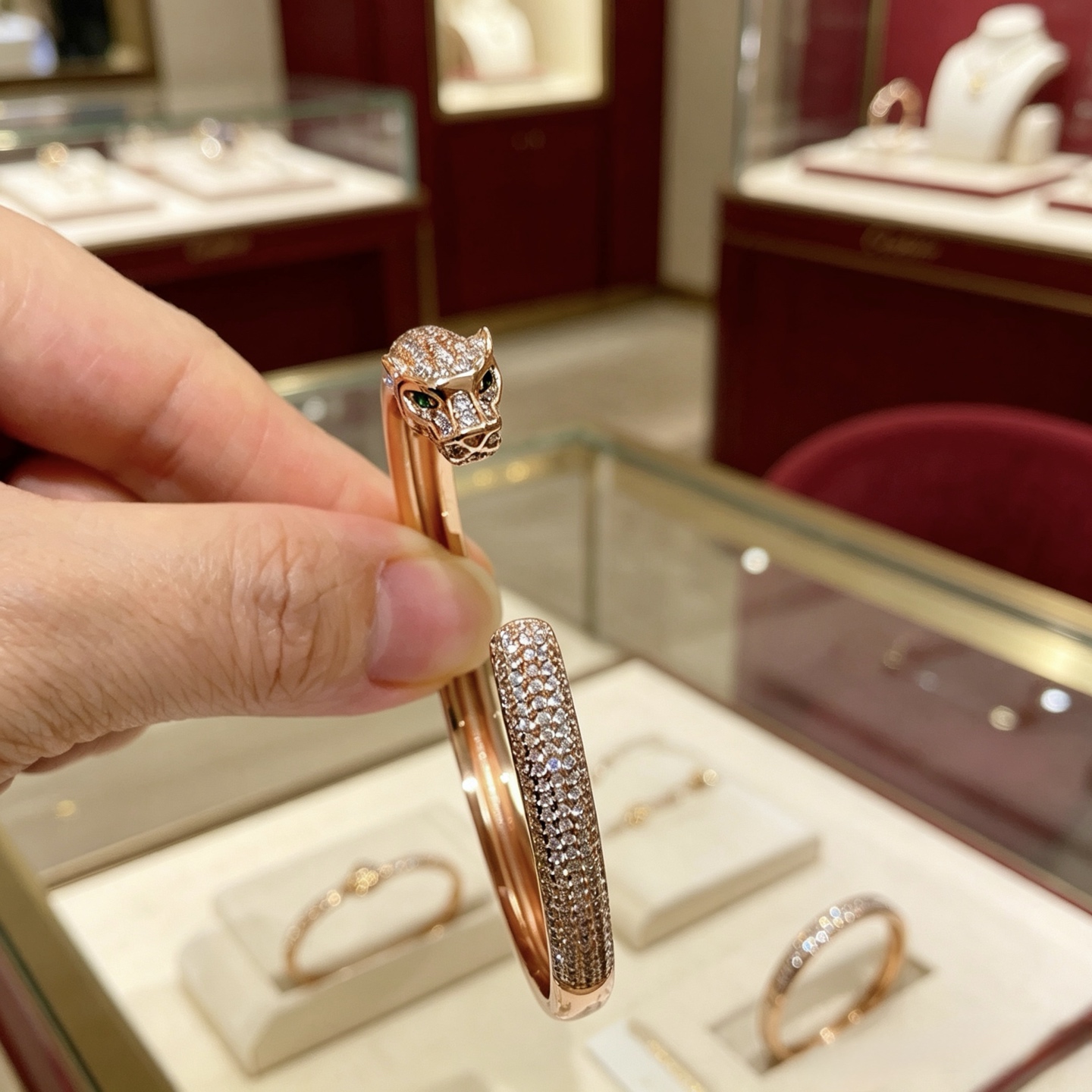 Cartier Panthere de Cartier bracelet 18K rose gold pave set white diamonds green tsavorite garnet eyes 17