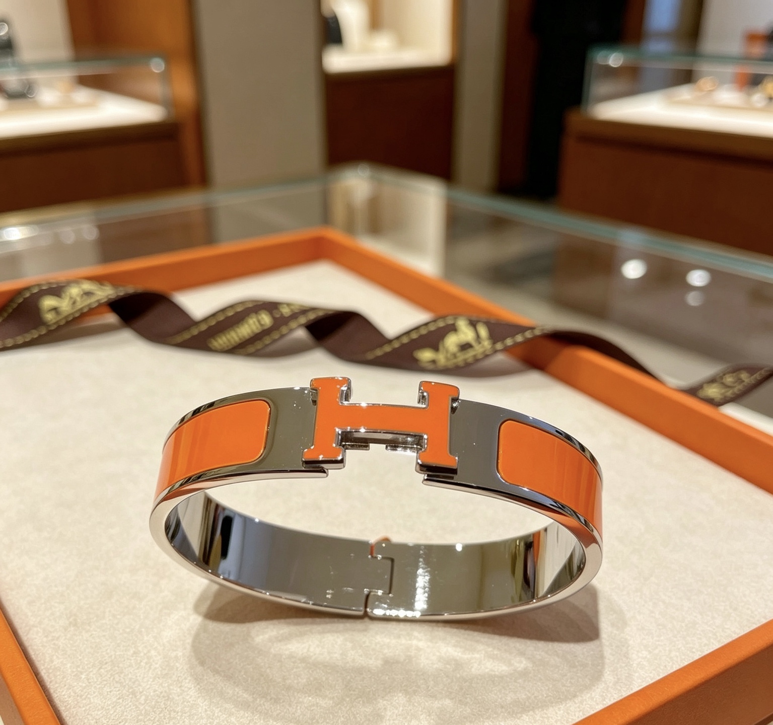 Bracciale Hermes Clic H in metallo argentato placcato palladio smalto arancione PM