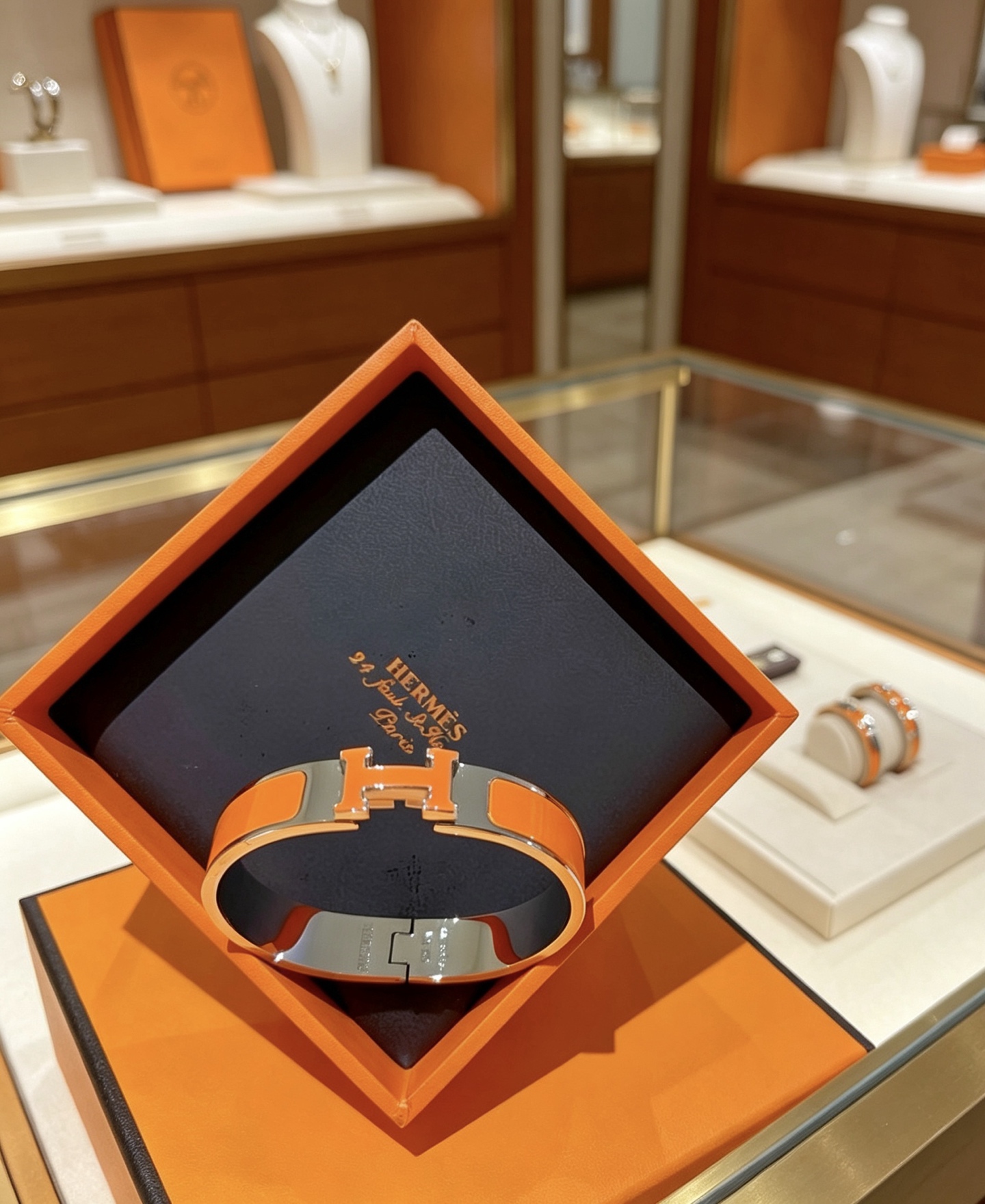 Bracciale Hermes Clic H in metallo argentato placcato palladio smalto arancione PM