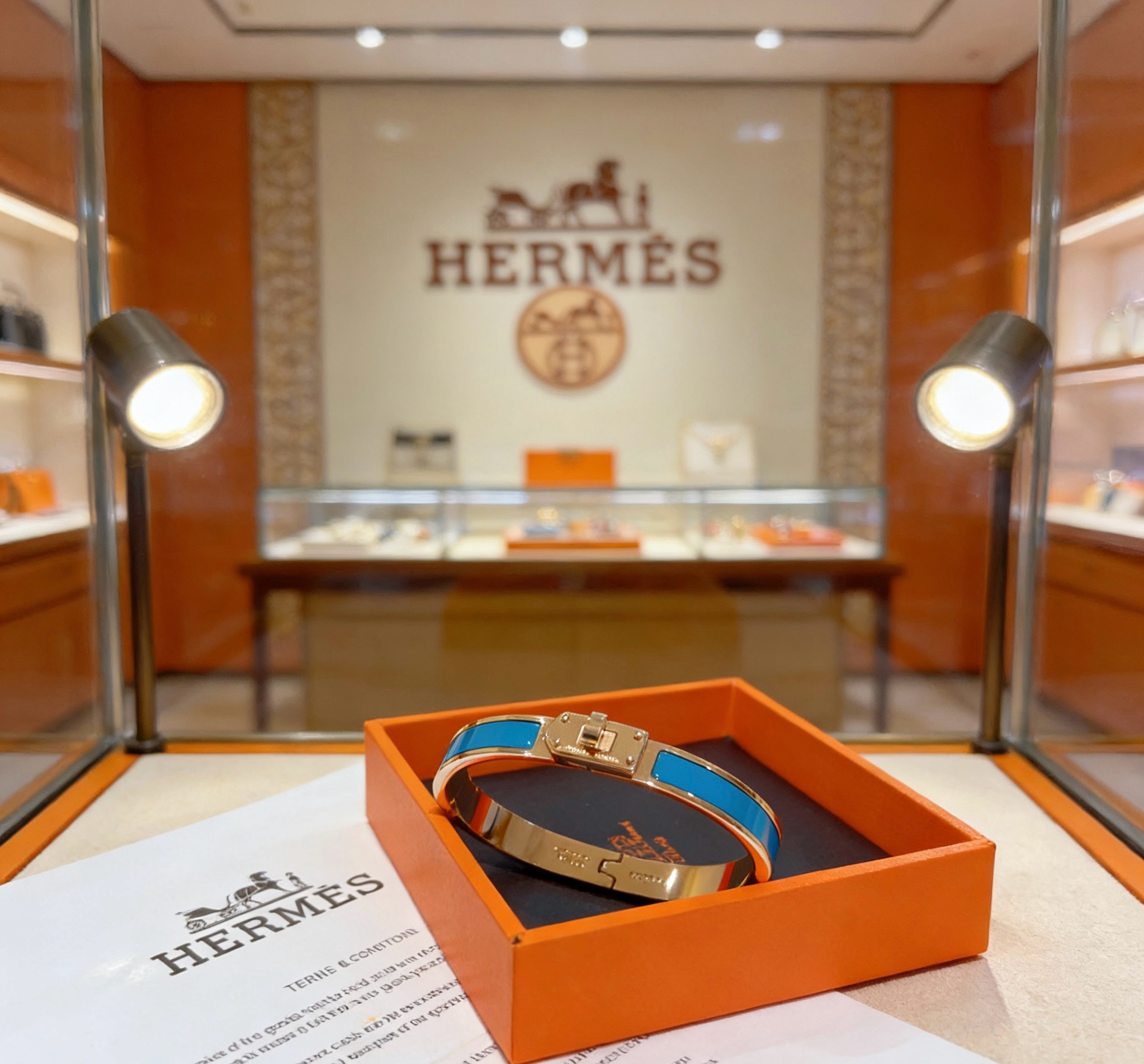Bracelet Hermes Kelly métal doré rose et émail bleu PM