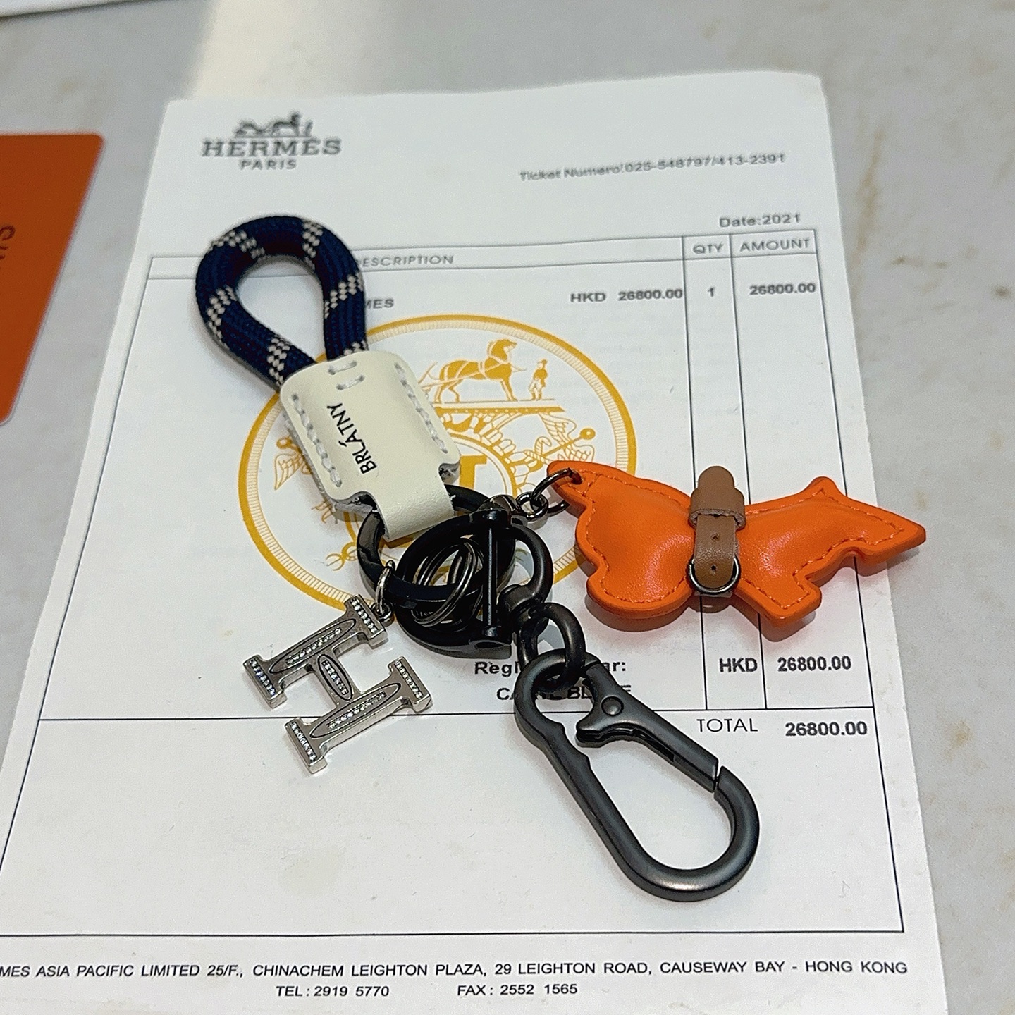 Hermes Rodeo Horse Charm Porte-clés pendentif Breloque cheval en cuir orange avec accents bleus bracelet en cuir marron cordon tressé vert foncé matériel en bronze à canon breloque de sac d'argent doré breloque logo H argenté 10 cm de longueur totale
