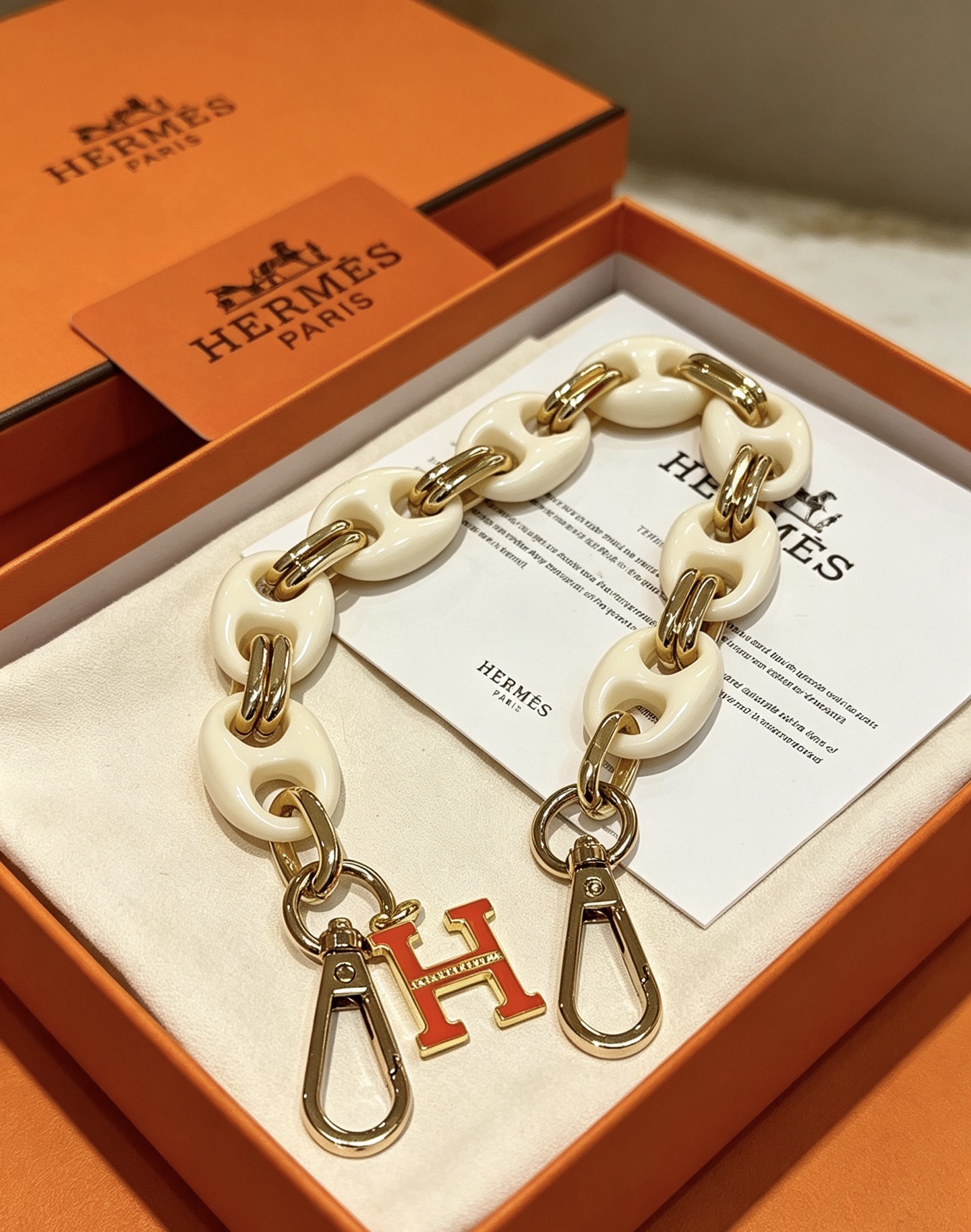 Hermes H Logo Bag Charm Chain pendant Cream white resin gold-tone metal orange enamel 18cm