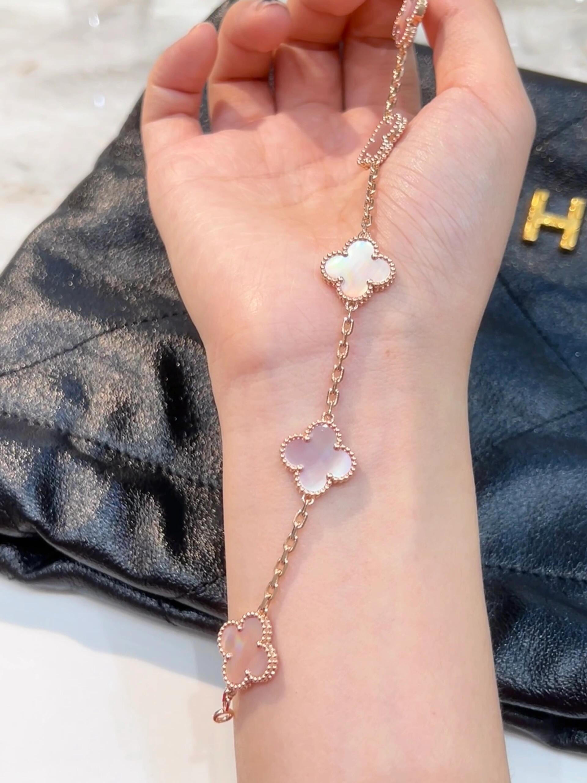 Van Cleef Arpels Alhambra bracelet Yellow gold with pink mother-of-pearl and iridescent mother-of-pearl clover motifs 18cm