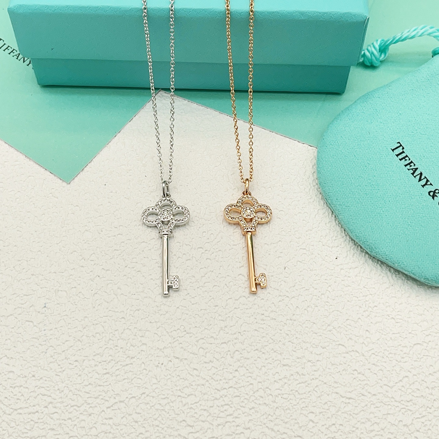 Tiffany Co Tiffany Keys Crown Key Pendant necklace 18k rose gold with clear diamond accents 18 inches